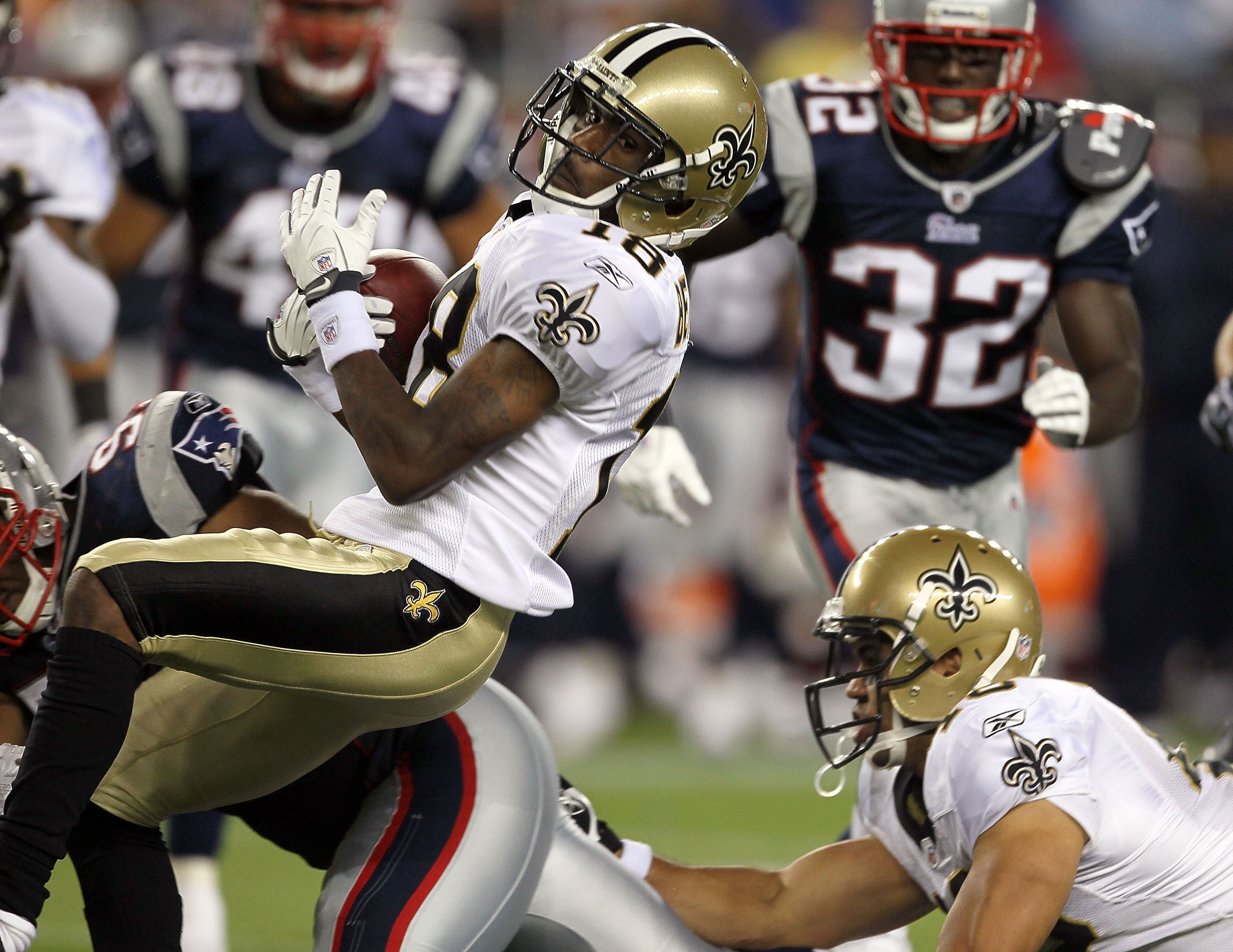FOXBORO, MA - AUGUST 12: Larry Beavers # 18 of the New Orleans Saints gains yardage in the second half against the New England Patriots during the preseason game at Gillette Stadium on August 12, 2010 in Foxboro, Massachusetts. (Photo by Jim Rogash/Getty 