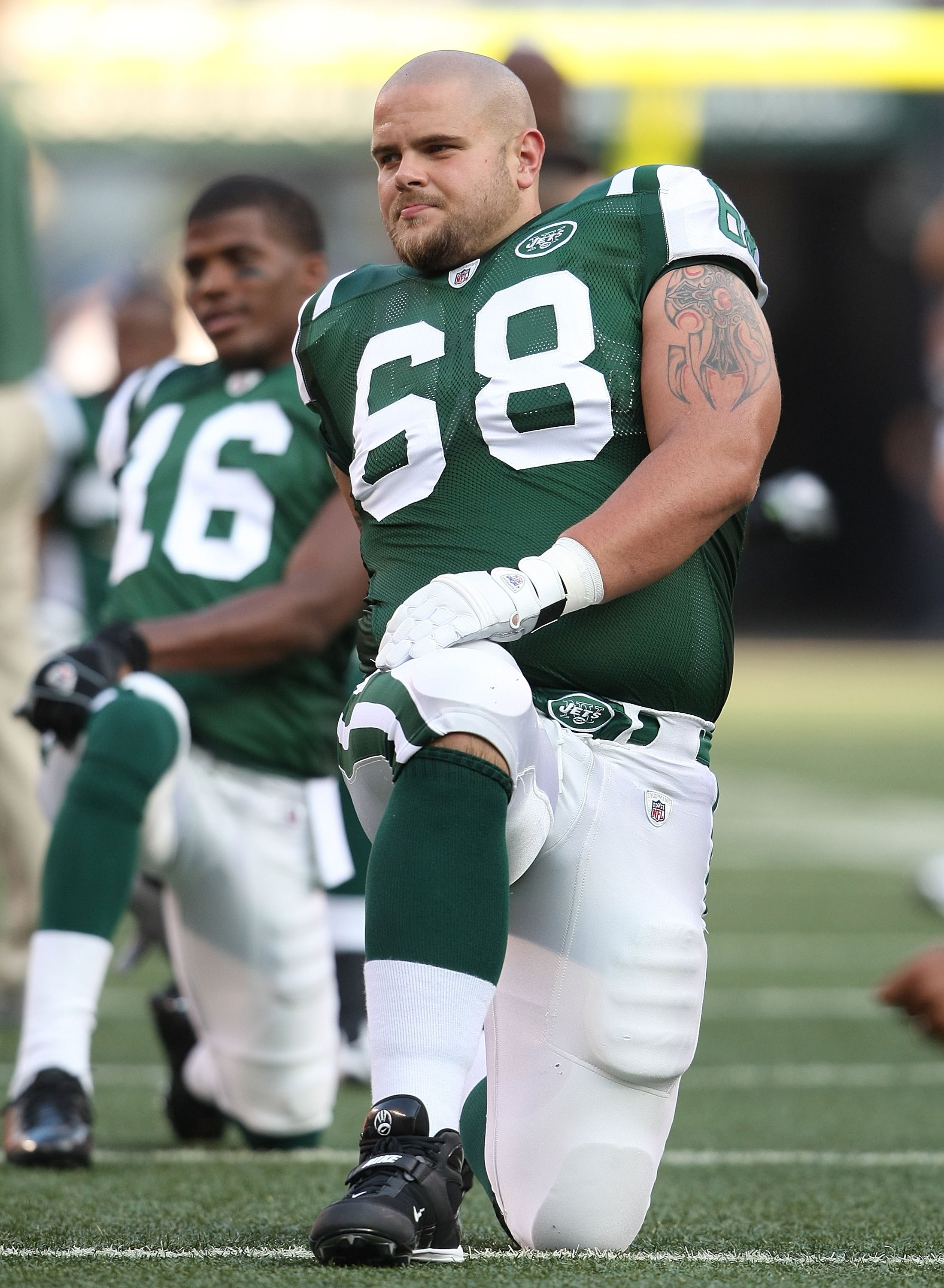 EAST RUTHERFORD, NJ - AUGUST 14:  Matt Slauson #68 of the New York Jets  warms up against the St. Louis Rams during their preseason game at Giants Stadium on August 14, 2009  in East Rutherford, New Jersey.  (Photo by Nick Laham/Getty Images)