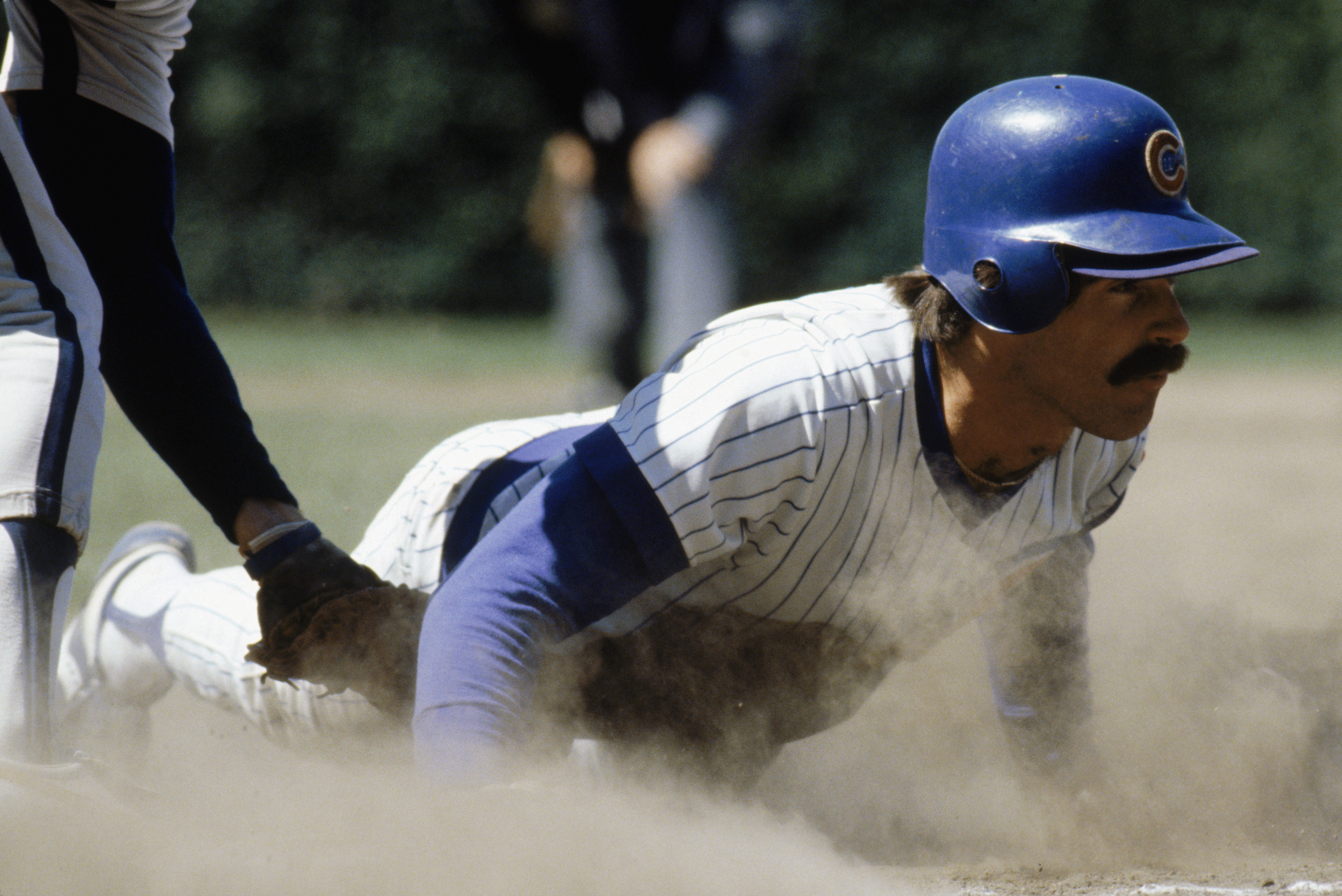 CHICAGO -1980:  Bill Buckner #22 of the Chicago Cubs slides across a base during a game in the 1980 season at Wrigley Field in Chicago, Illinois .  (Photo by: Jonathan Daniel/Getty Images)