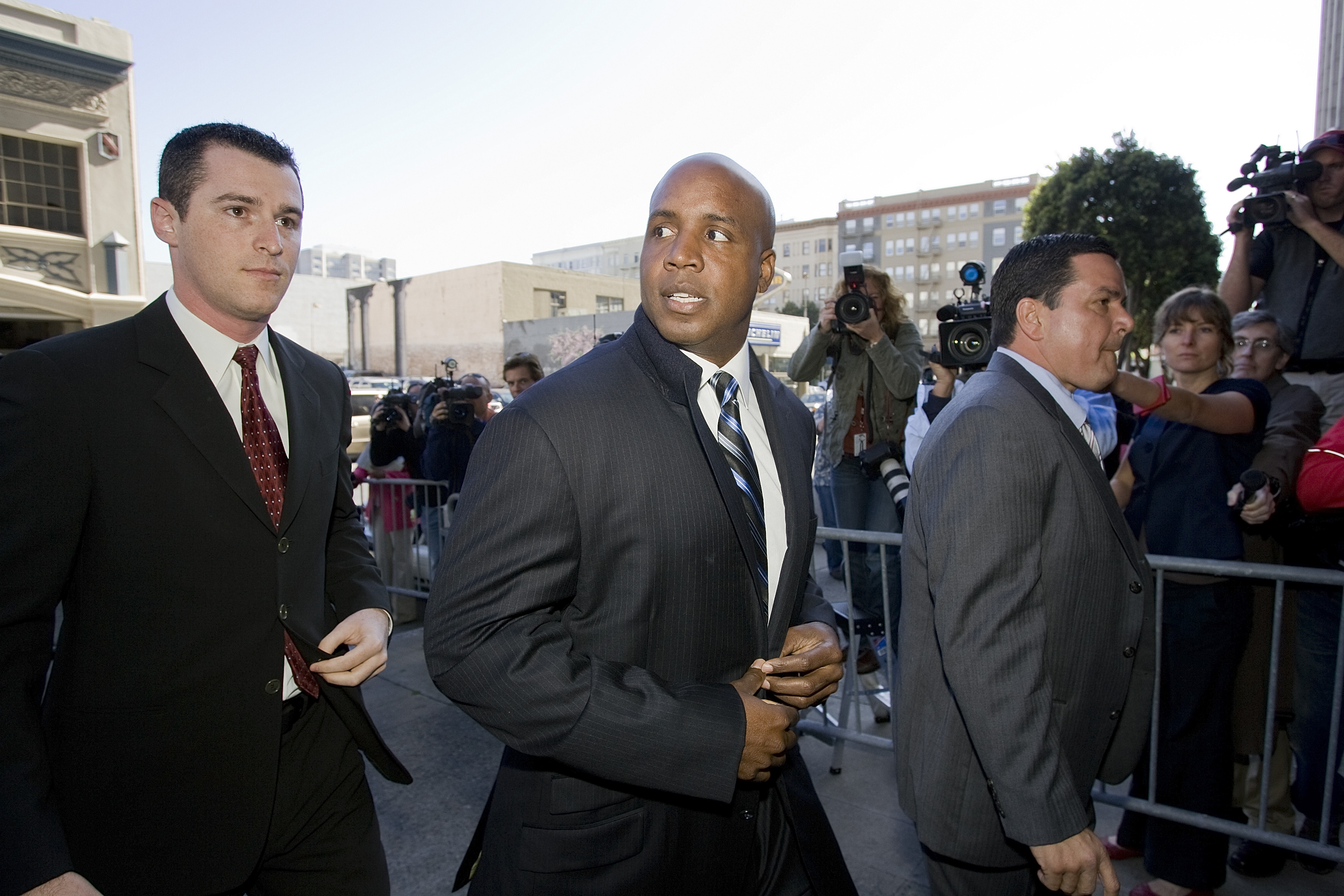 SAN FRANCISCO - JUNE 6:  Barry Bonds (C) arrives at the Phillip Burton Federal Building and United States Court House to make two appearances in United States District Court June 6, 2008 in San Francisco, California.  Bonds was arraigned on 14 counts of f