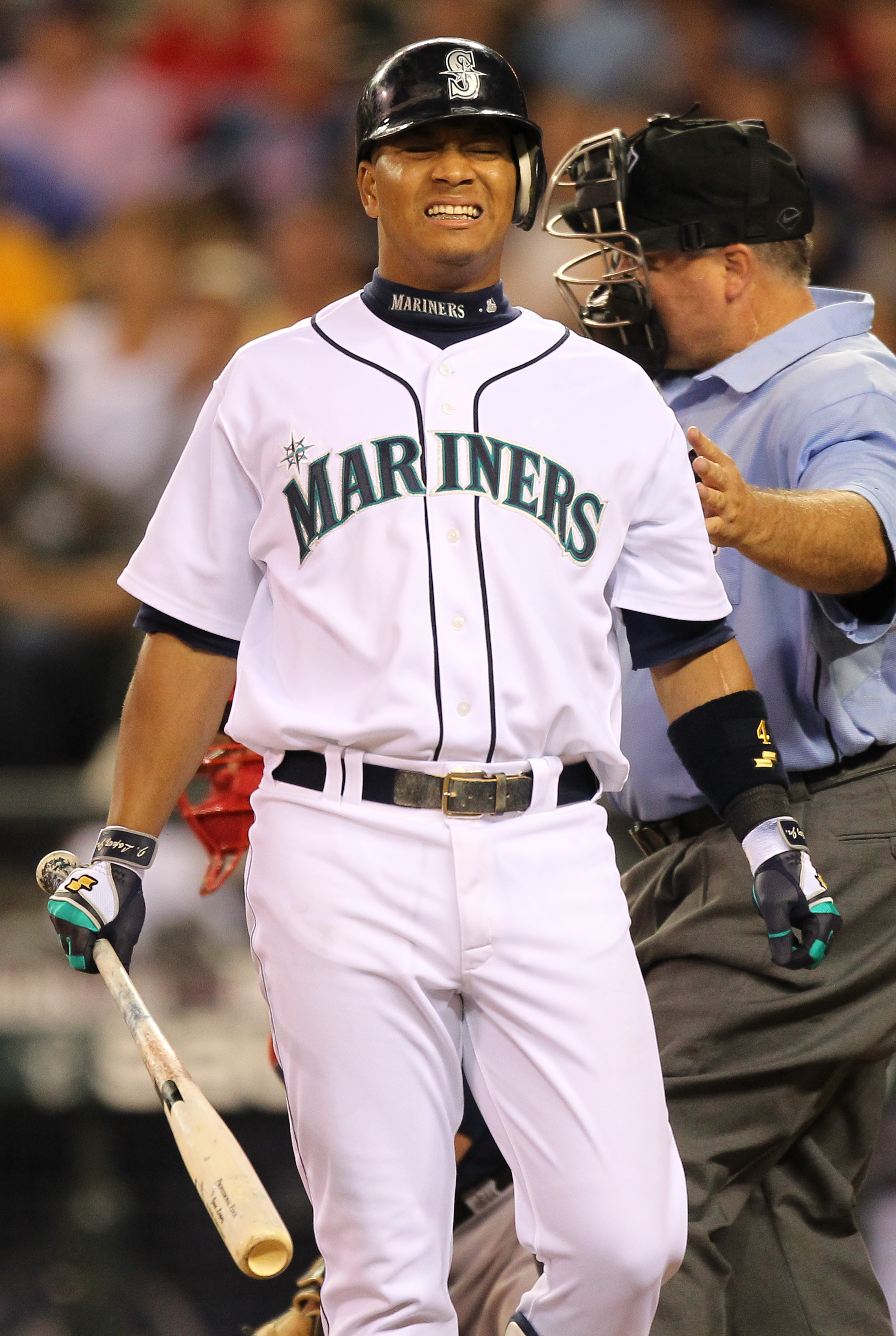 SEATTLE - JULY 24:  Jose Lopez #4 of the Seattle Mariners grimaces after being hit with a pitch against the Boston Red Sox at Safeco Field on July 24, 2010 in Seattle, Washington. (Photo by Otto Greule Jr/Getty Images)