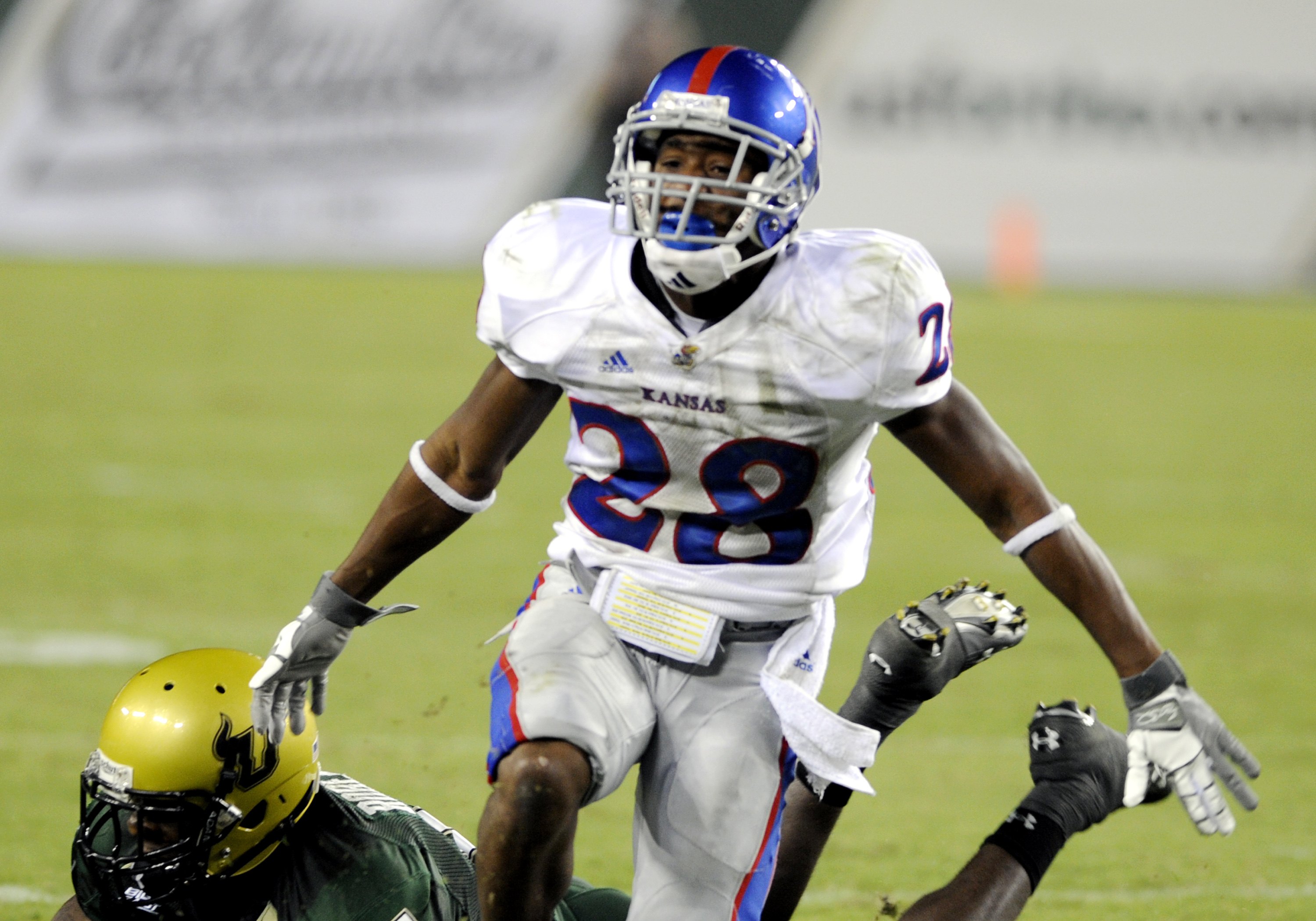 TAMPA, FL - SEPTEMBER 12: Wide receiver Daymond Patterson #28 of the Kansas University Jayhawks dives or a pass against the University of South Florida Bulls at Raymond James Stadium on September 12, 2008 in Tampa, Florida. (Photo by Al Messerschmidt/Get