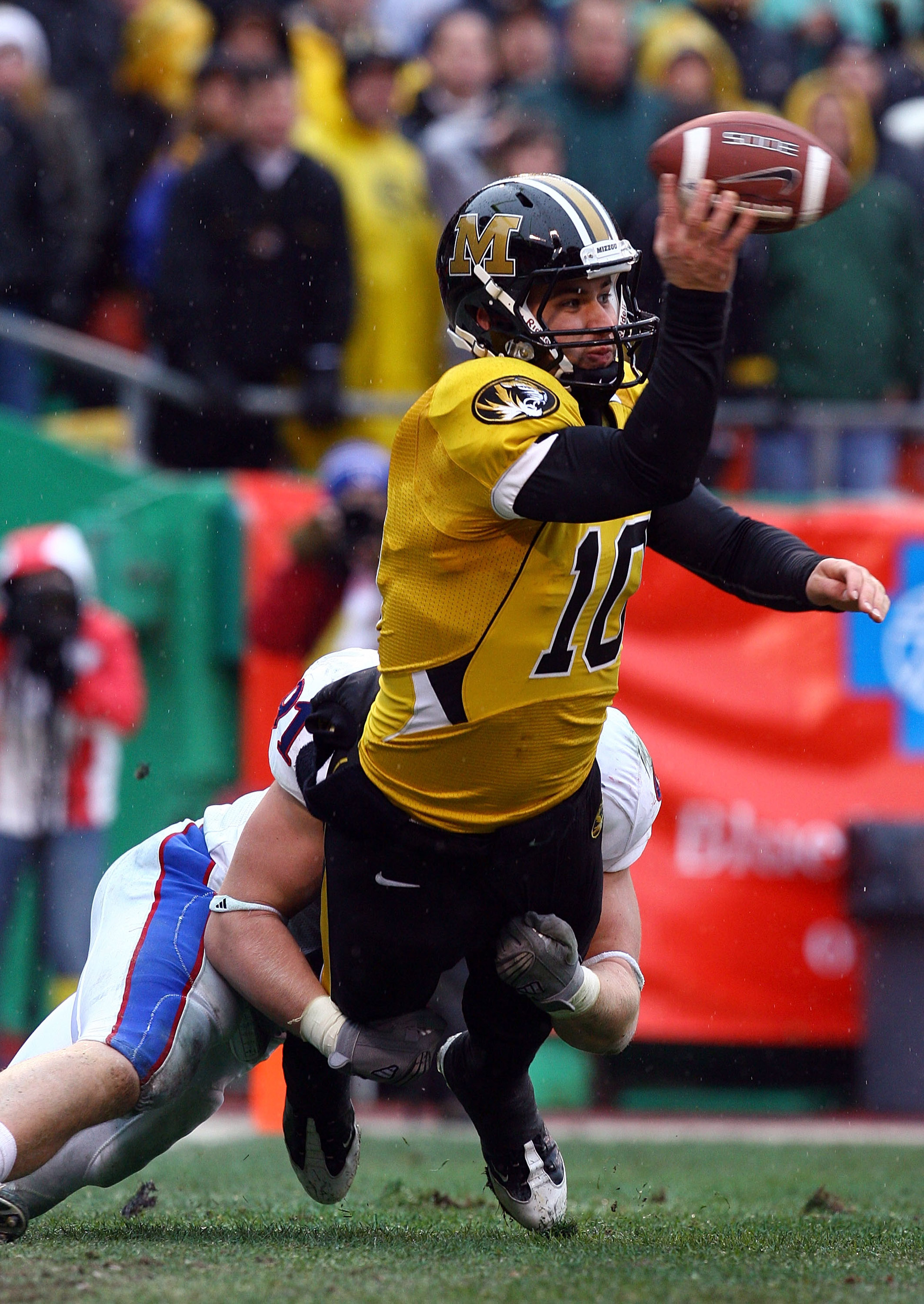KANSAS CITY, MO - NOVEMBER 29: Quarterback Chase Daniel #10 of the Missouri Tigers is sacked in the end-zone for a sefety by Jake Laptad #91 of the Kansas Jayhawks during the game on November 29, 2008 at Arrowhead Stadium in Kansas City, Missouri. (Phot