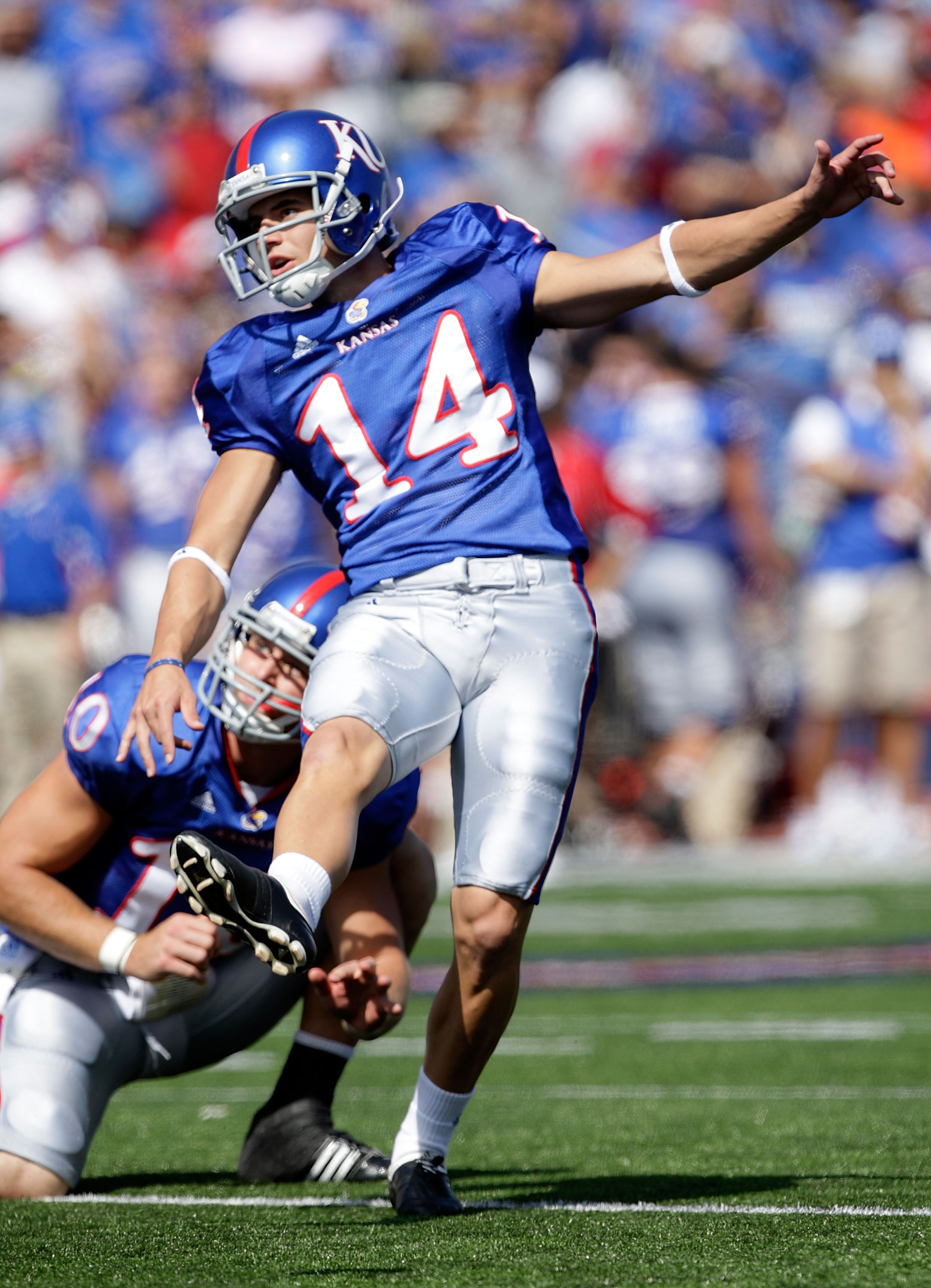 LAWRENCE, KS - SEPTEMBER 19: Jacob Branstetter #14 of the Kansas Jayhawks kicks an extra point during the game against the Duke Blue Devils on Kivisto Field at Memorial Stadium on September 19, 2009 in Lawrence, Kansas. (Photo by Jamie Squire/Getty Imag