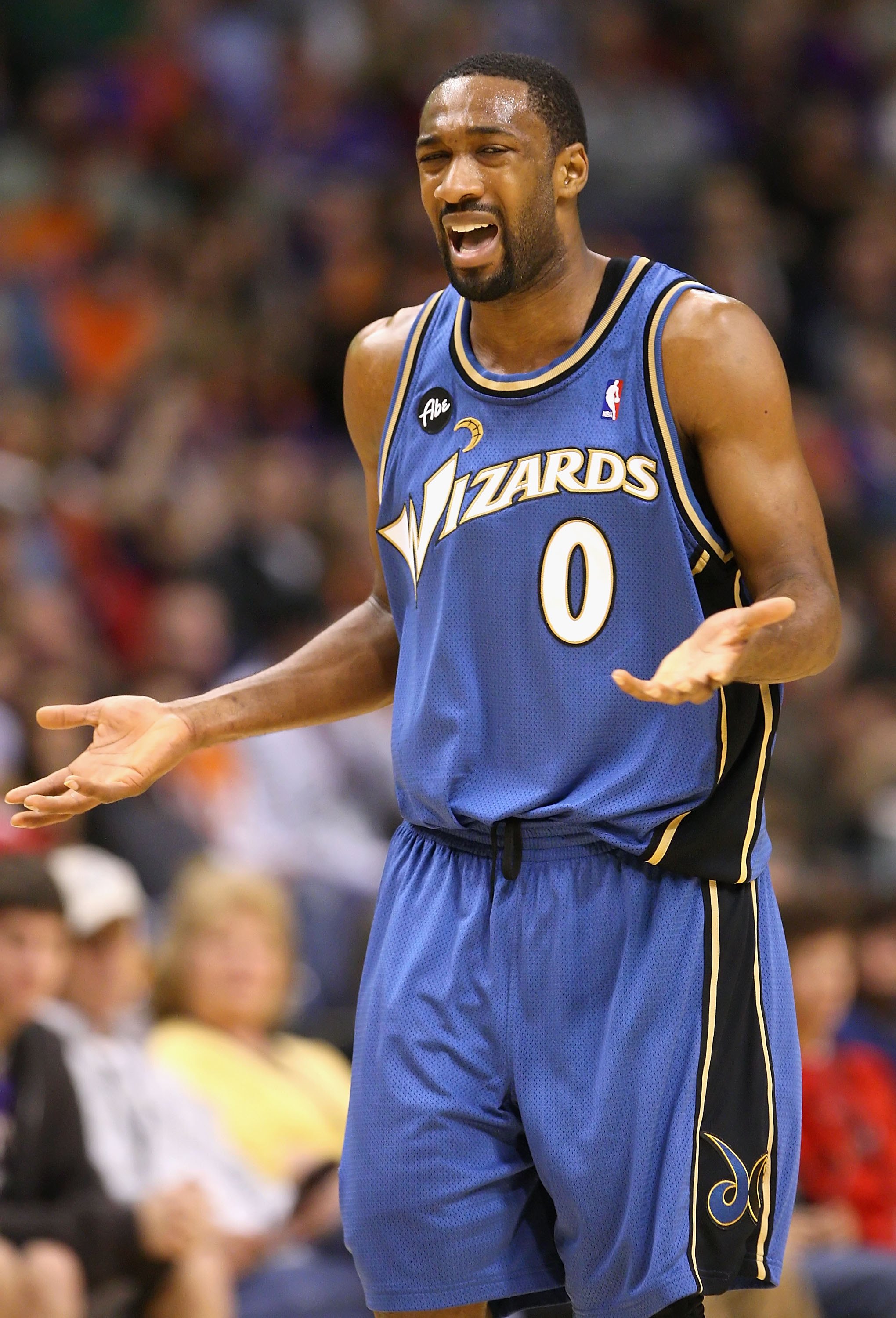 PHOENIX - DECEMBER 19:  Gilbert Arenas #0 of the Washington Wizards reacts during the NBA game against the Phoenix Suns at US Airways Center on December 19, 2009 in Phoenix, Arizona. The Suns defeated the Wizards 121-95. NOTE TO USER: User expressly ackno
