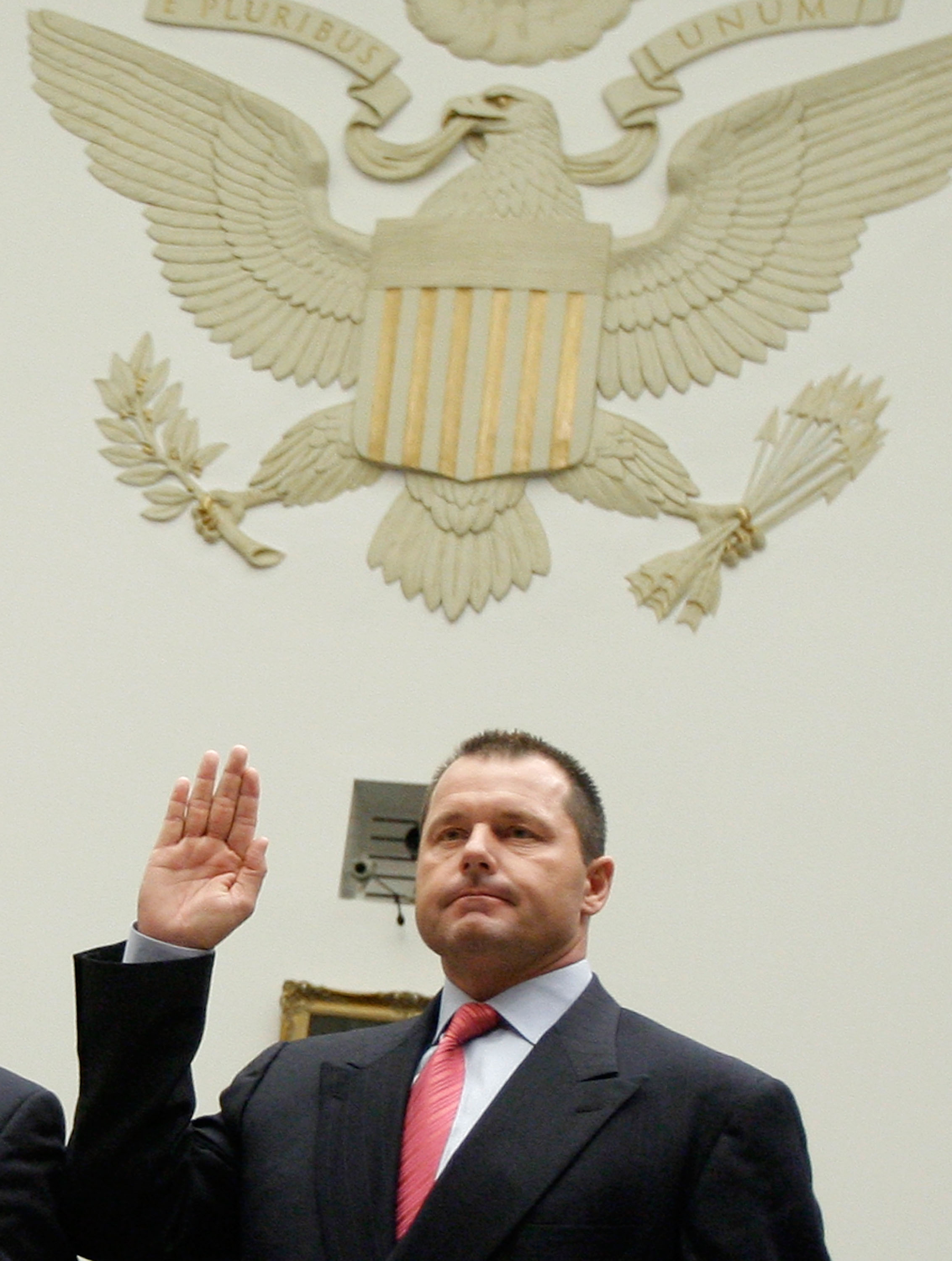 WASHINGTON - FEBRUARY 13:  Major League Baseball player Roger Clemens raises his right hand as he is sworn in during a House Oversight and Government Reform Committee, February 13, 2008 in Washington DC. The committee is hearing testimony on the use the i