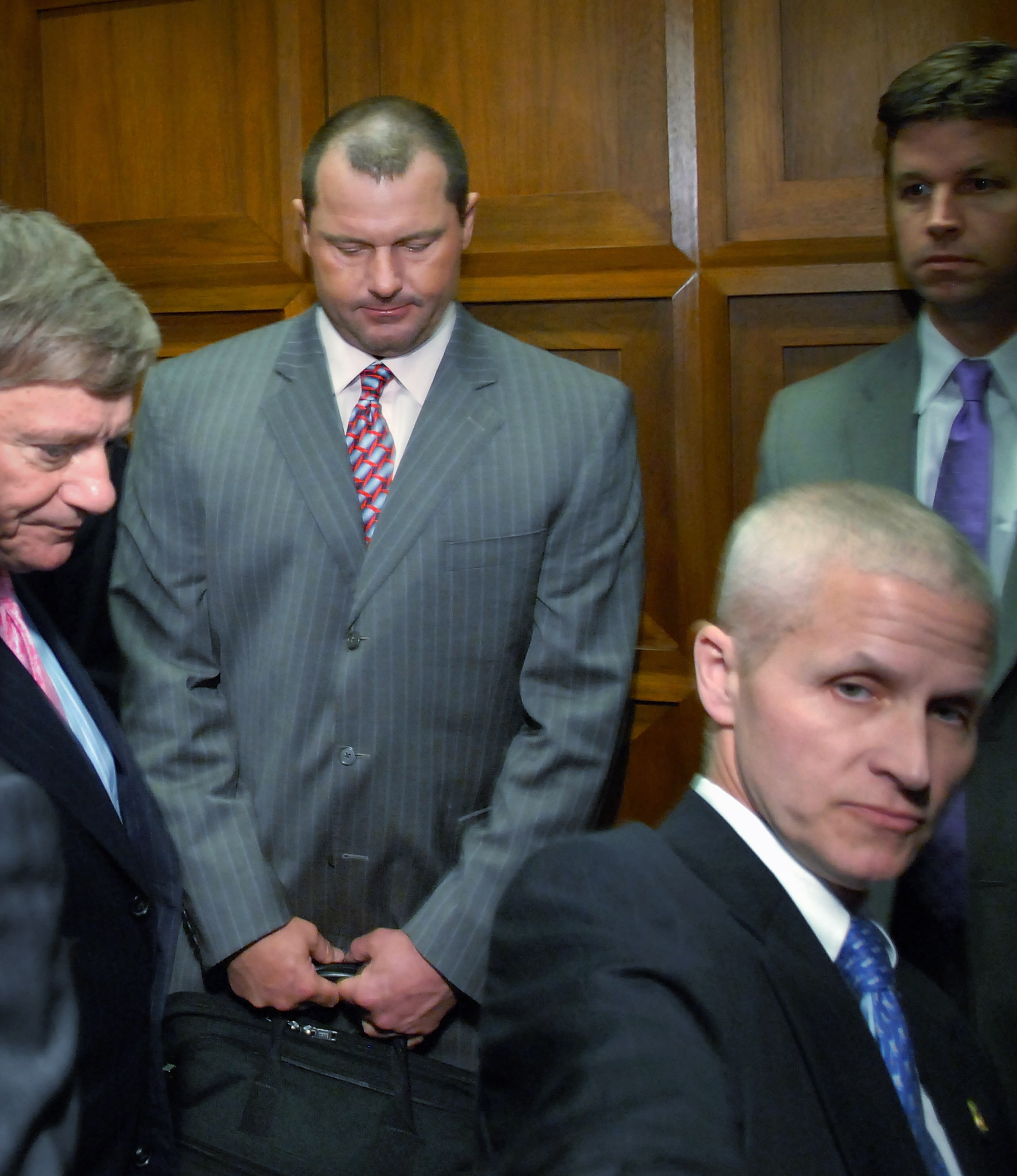 WASHINGTON - FEBRUARY 05:  Former New York Yankees pitcher Roger Clemens (2nd L) departs on an elevator after being deposed by the House Oversight and Government Reform Committee about steroid use in Major League Baseball, February 5, 2008 in Washington.