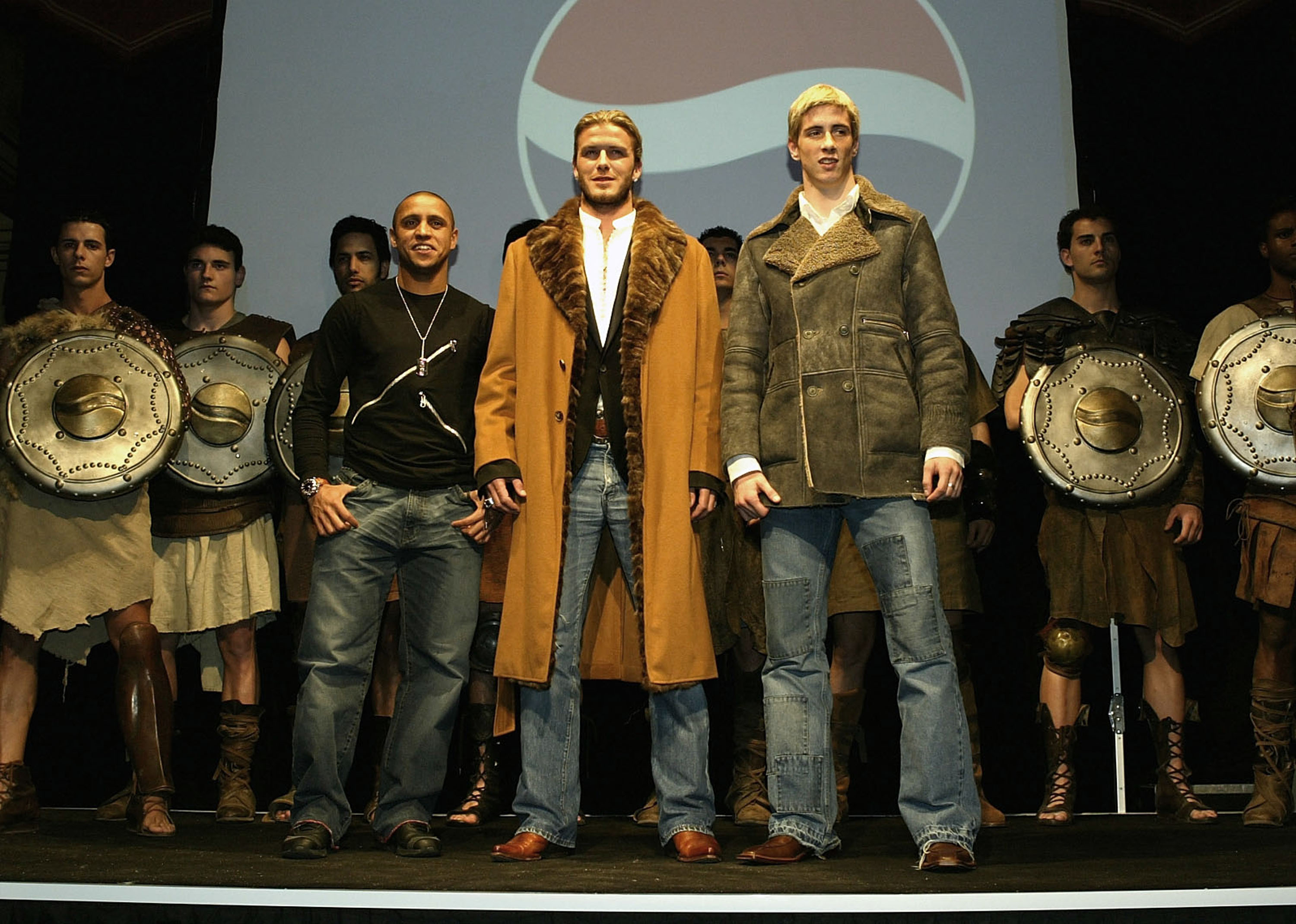 MADRID, SPAIN - FEBRUARY 26:  Footballers Roberto Carlos, David Beckham and Fernando Torres pose during the Premiere of the new Pepsi Football Commercial 'Pepsi Foot Battle' at the Palacio Gaviria on February 26, 2004 in Madrid, Spain. (Photo by Clive Bru