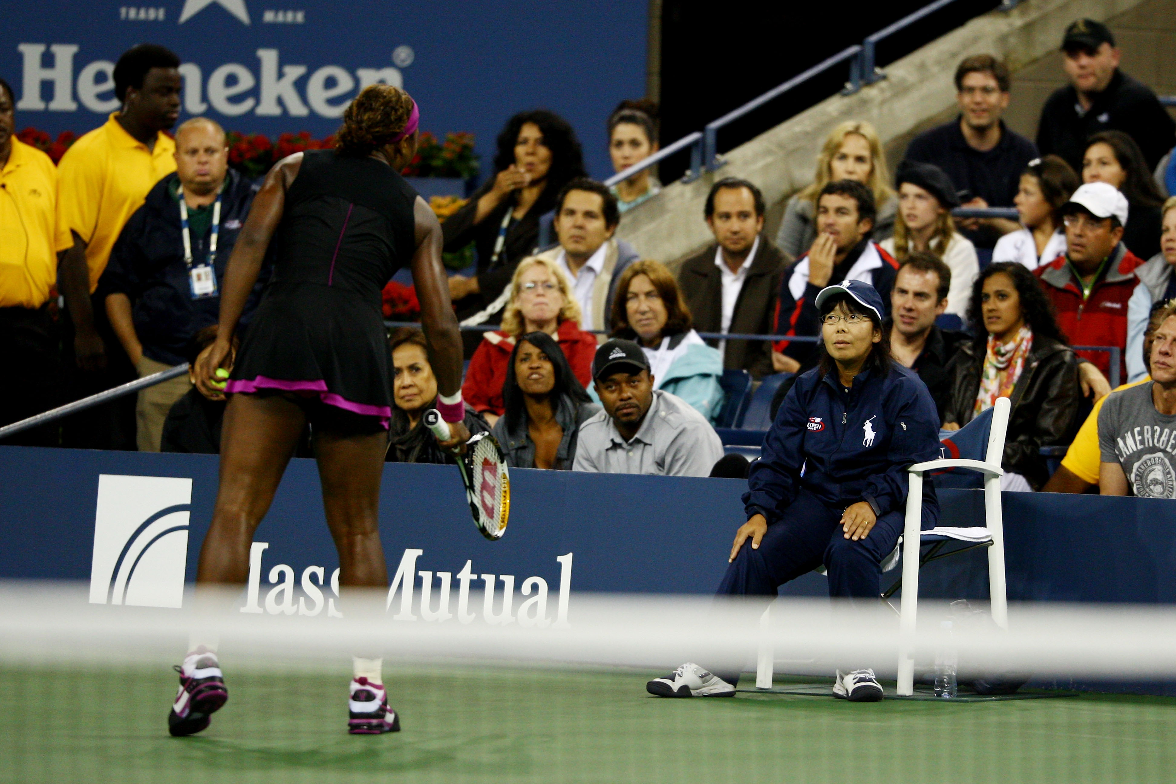 NEW YORK - SEPTEMBER 12:  Serena Williams (L) argues with a line judge during her Women's Singles Semifinal match against Kim Clijsters of Belgium on day thirteen of the 2009 U.S. Open at the USTA Billie Jean King National Tennis Center on September 12, 2