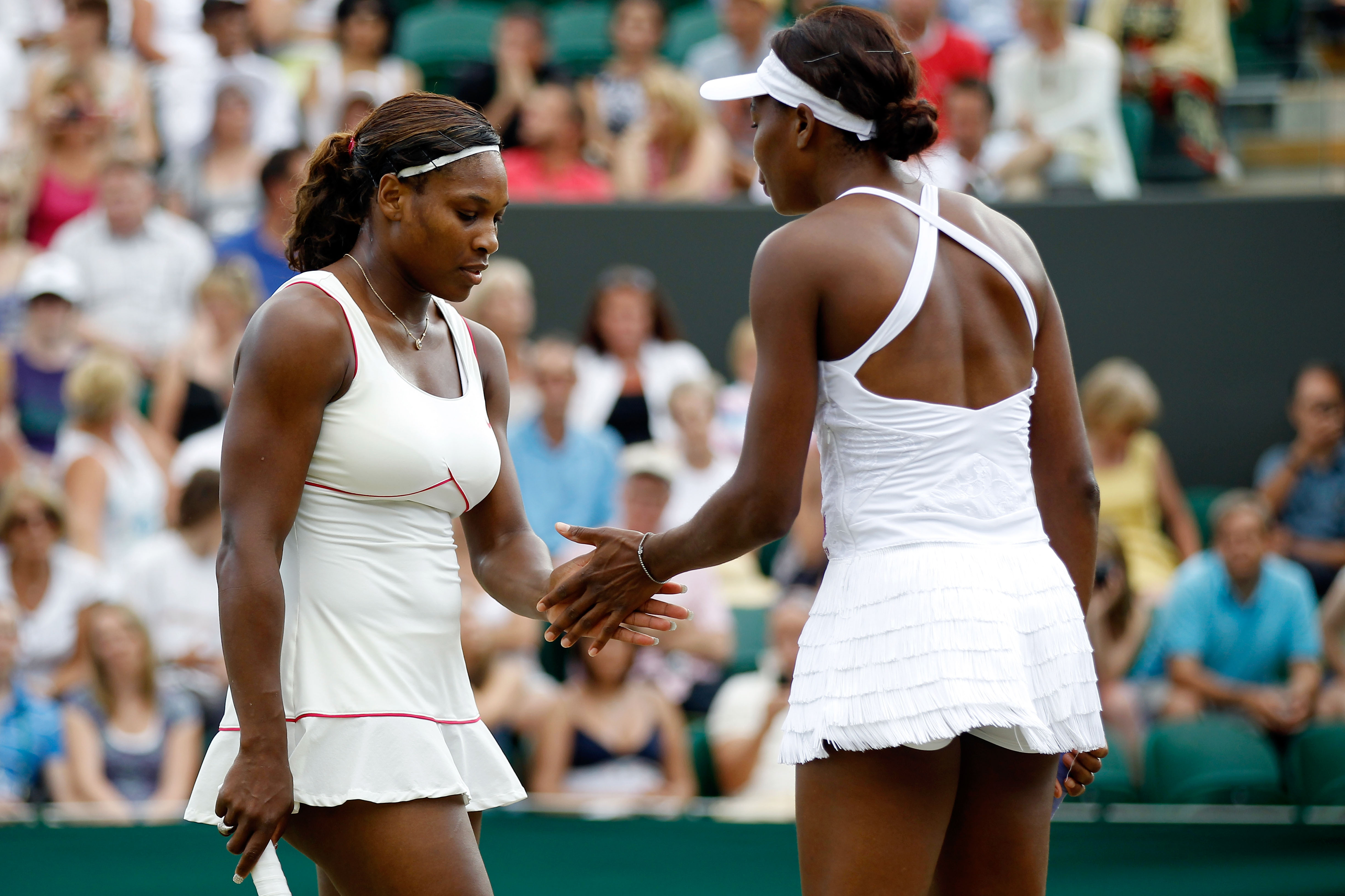 LONDON, ENGLAND - JUNE 26:  Serena Williams of USA and Venus Williams of USA in action during their doubles match against Dominika Cibulkova of Slovakia and Anastasia Pavlyuchenkova of Russia  on Day Six of the Wimbledon Lawn Tennis Championships at the A
