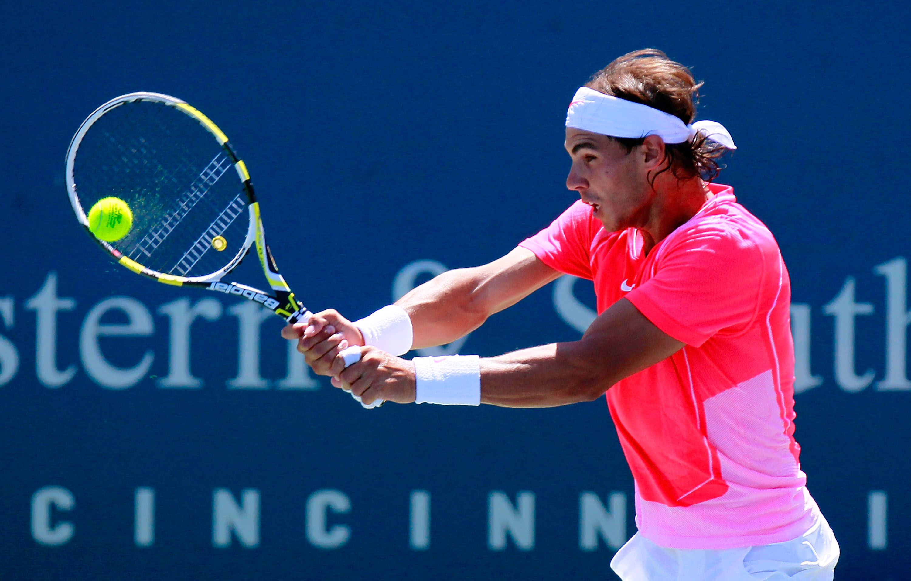 CINCINNATI - AUGUST 18:  Rafael Nadal of Spain returns a backlhand to Taylor Dent during Day 3 of the Western & Southern Financial Group Masters at the Lindner Family Tennis Center on August 18, 2010 in Cincinnati, Ohio.  (Photo by Kevin C. Cox/Getty Imag