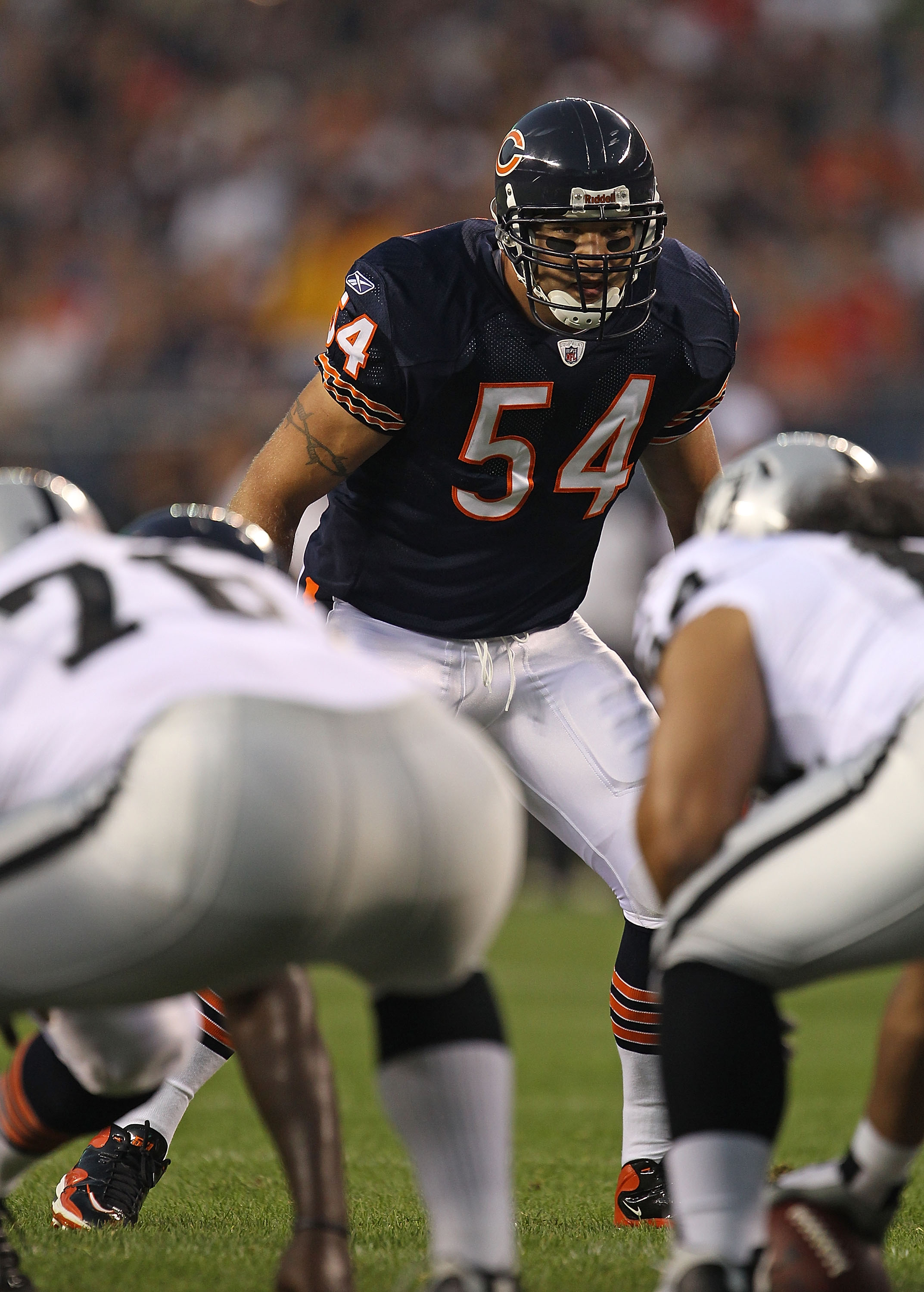 Chicago Bears linebacker Brian Urlacher (54) and quarterback Jay Cutler (6)  stand on the sidelines during