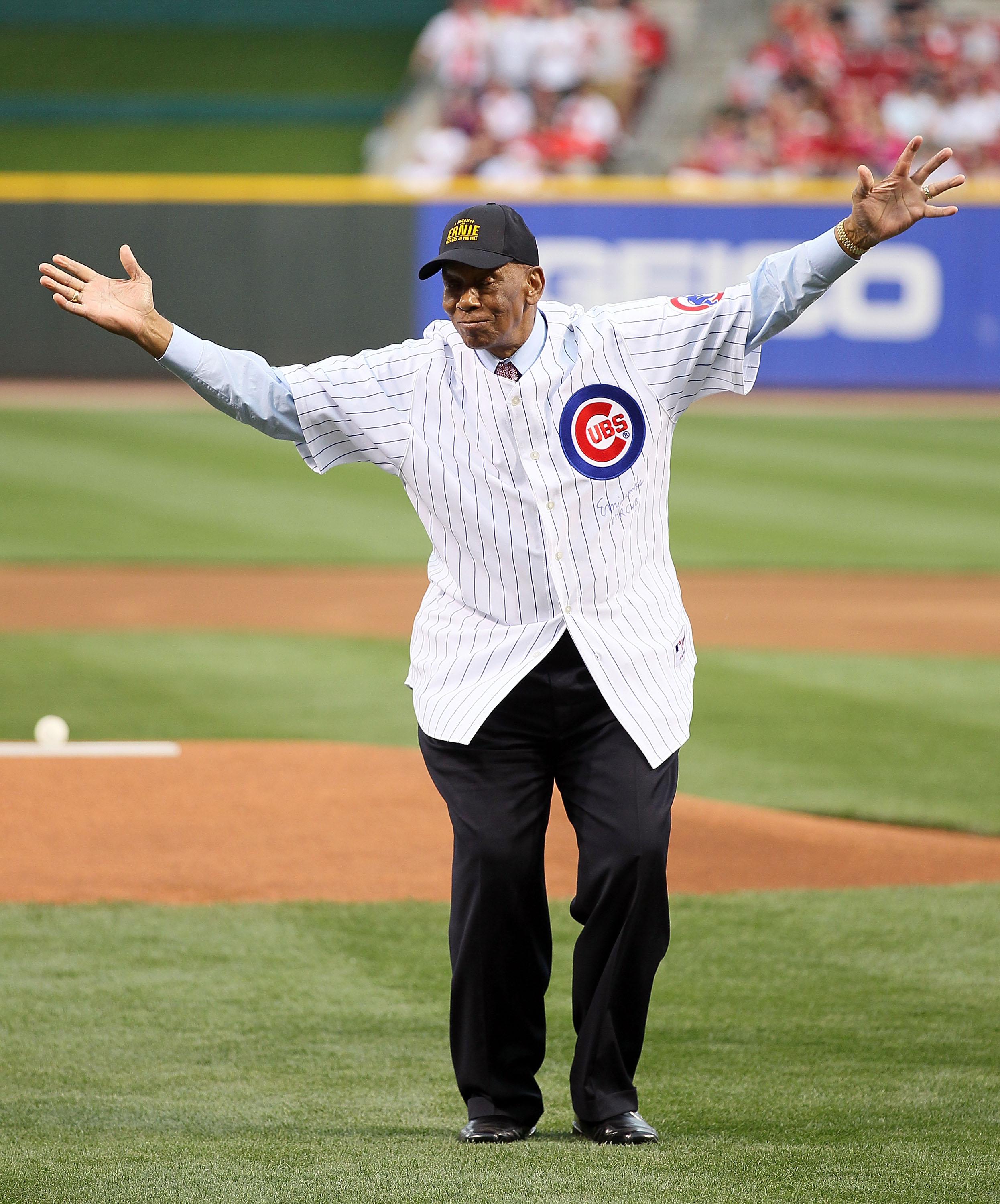 CINCINNATI - MAY 15:  Ernie Banks waves to the crowd after throwing out the first pitch before the Gillette Civil Rights Game between the Cincinnati Reds and the St. Louis Cardinals at Great American Ball Park on May 15, 2010 in Cincinnati, Ohio.  (Photo