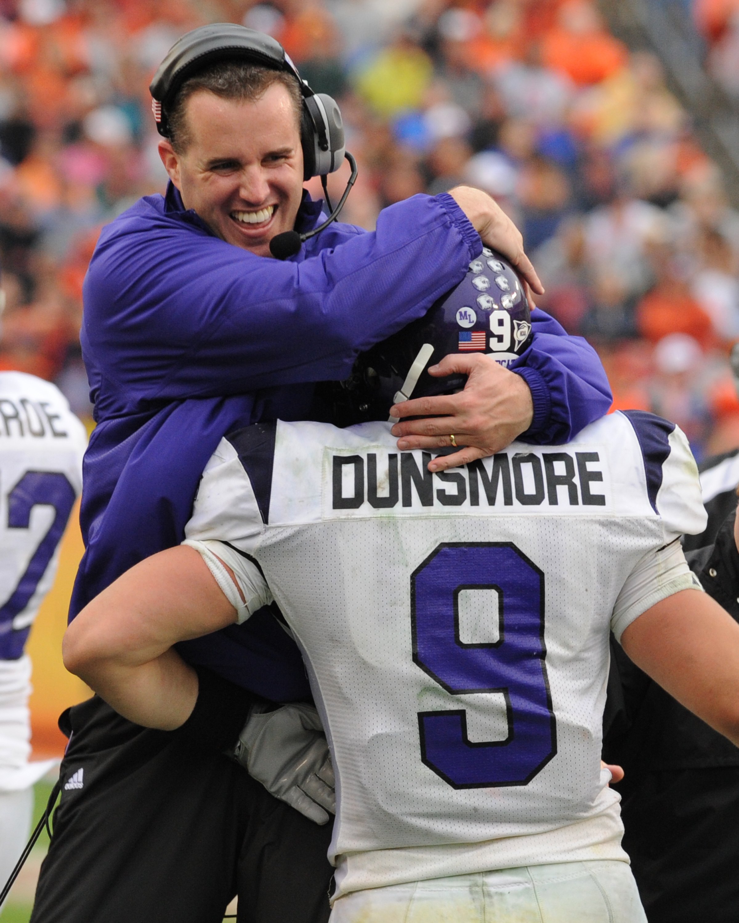 TAMPA, FL - JANUARY 1: Coach Pat Fitzgerald of the Northwestern Wildcats celebrates a touchdown catch by split back Drake Dunsmore #9 against the Auburn Tigers in the Outback Bowl January 1, 2010 at Raymond James Stadium in Tampa, Florida. (Photo by Al M