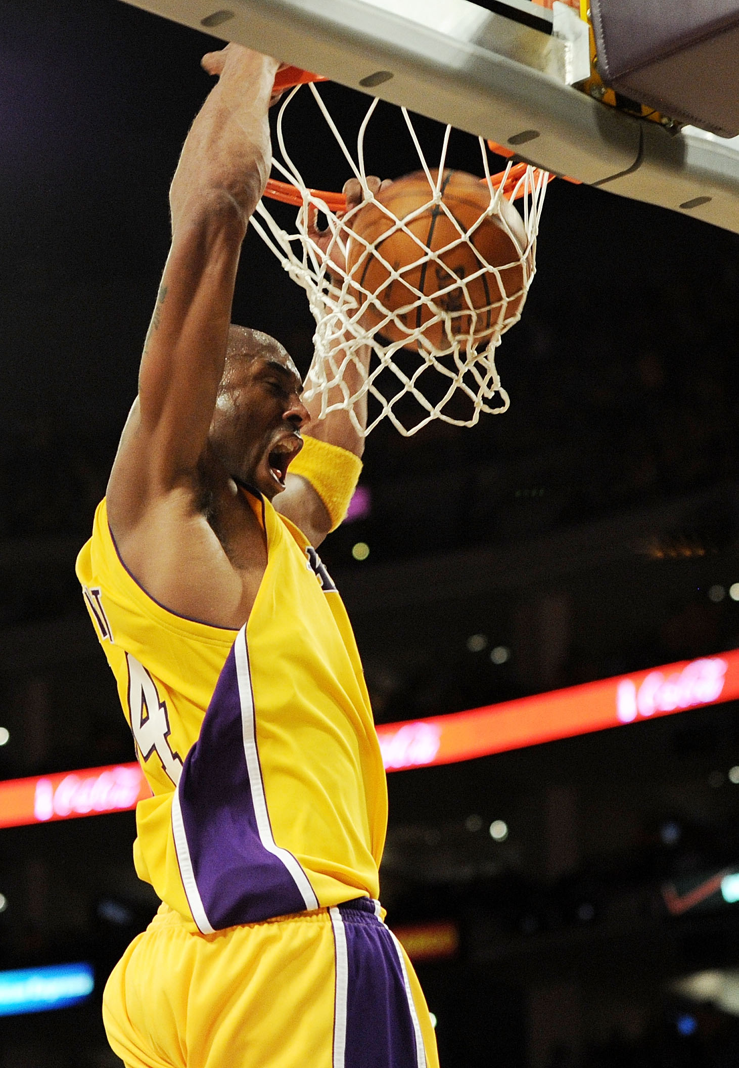 Kobe Bryant of the Los Angeles Lakers drives baseline against Doug