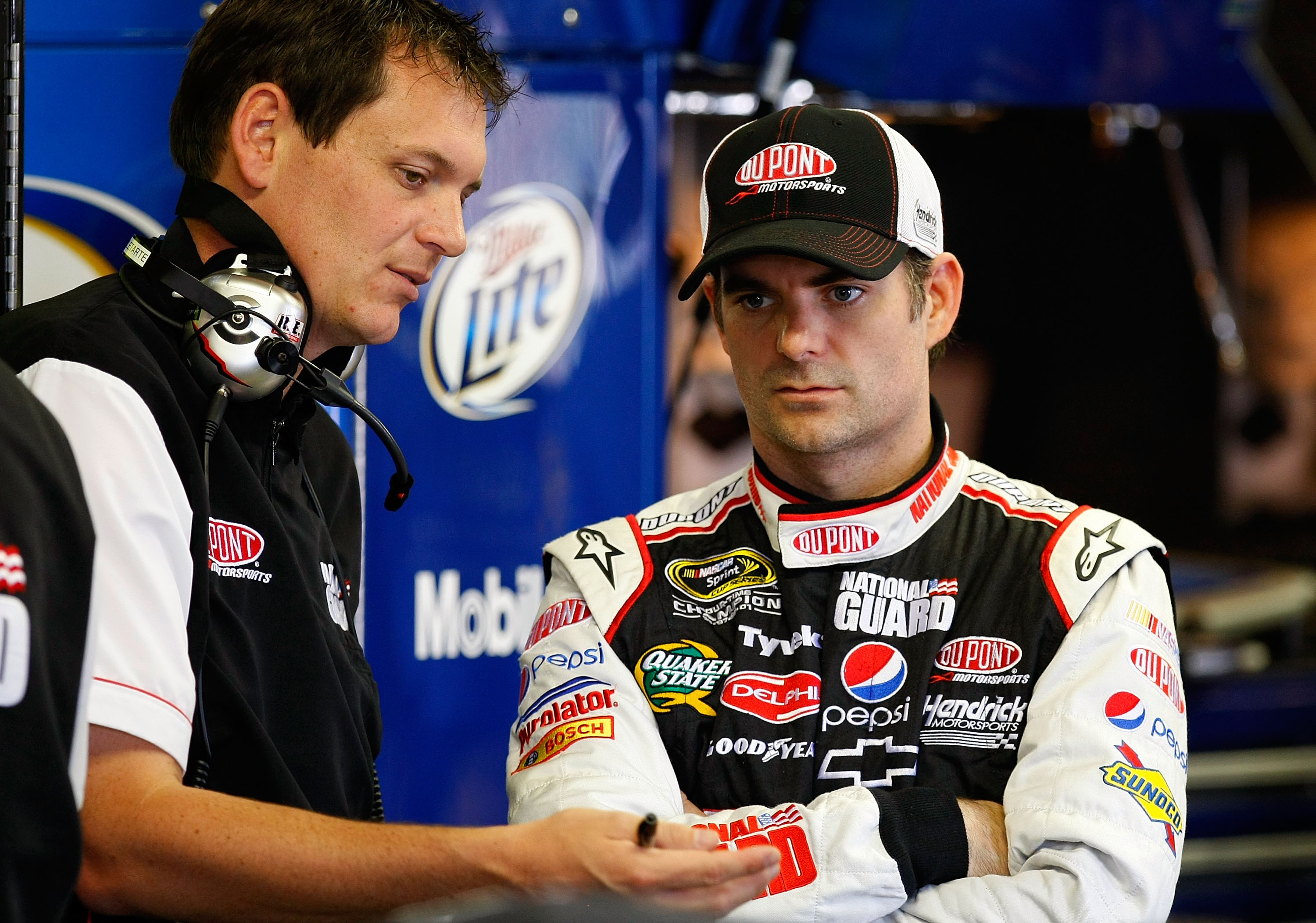 BROOKLYN, MI - JUNE 12: Jeff Gordon (R), driver of the #24 DuPont/National Guard Job Skills Chevrolet, talks with crew chief Steve Letarte (L) in the garage during practice for the NASCAR Sprint Cup Series Heluva Good! Sour Cream Dips 400 at Michigan Inte