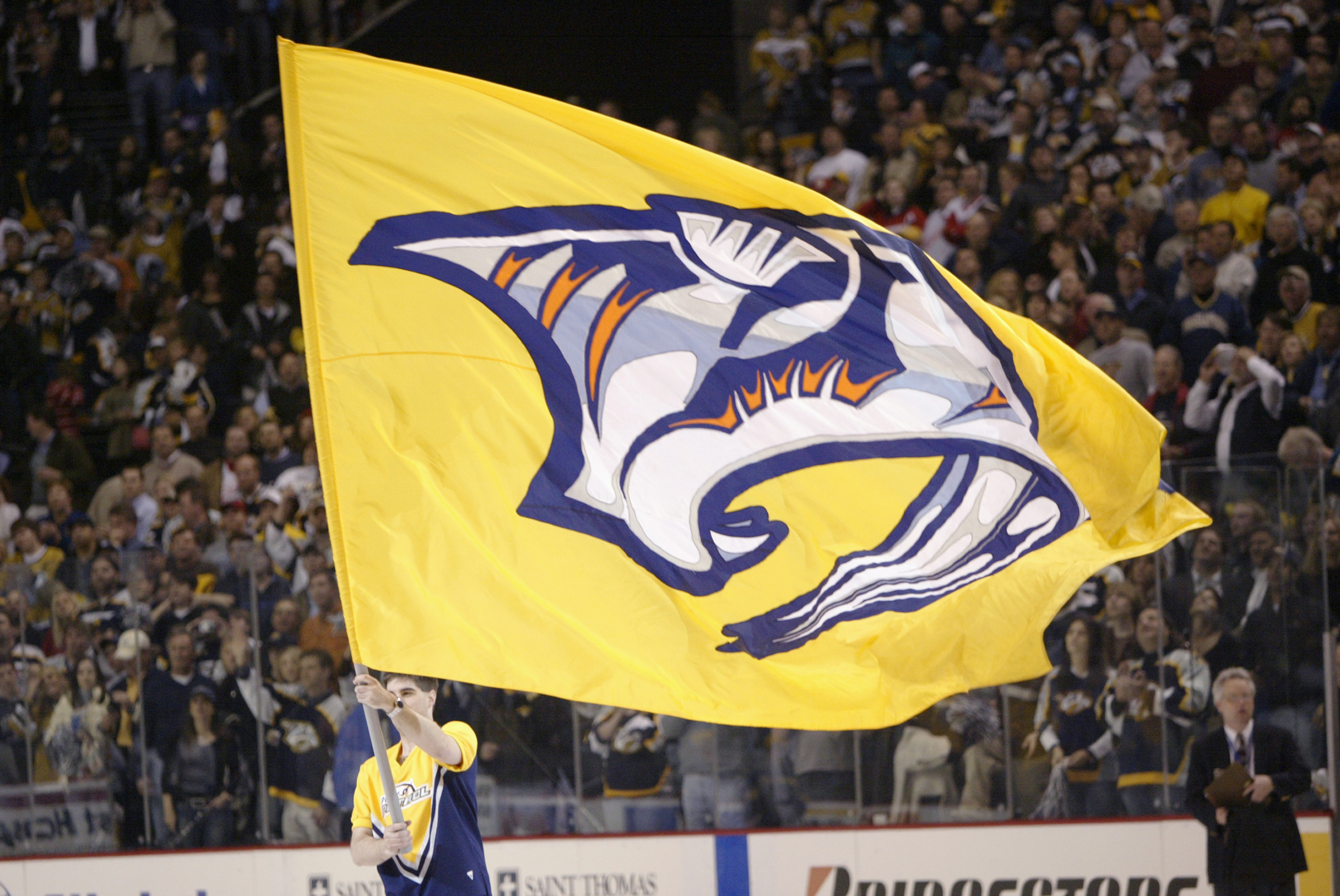 NASHVILLE - APRIL 13:  A Nashville Predators flag is paraded around the rink during a break in game four of the first round of the  2004 Stanley Cup playoffs against the Detroit Red Wings on April 13, 2004 at the Gaylord Center in Nashville, Tennessee. (P