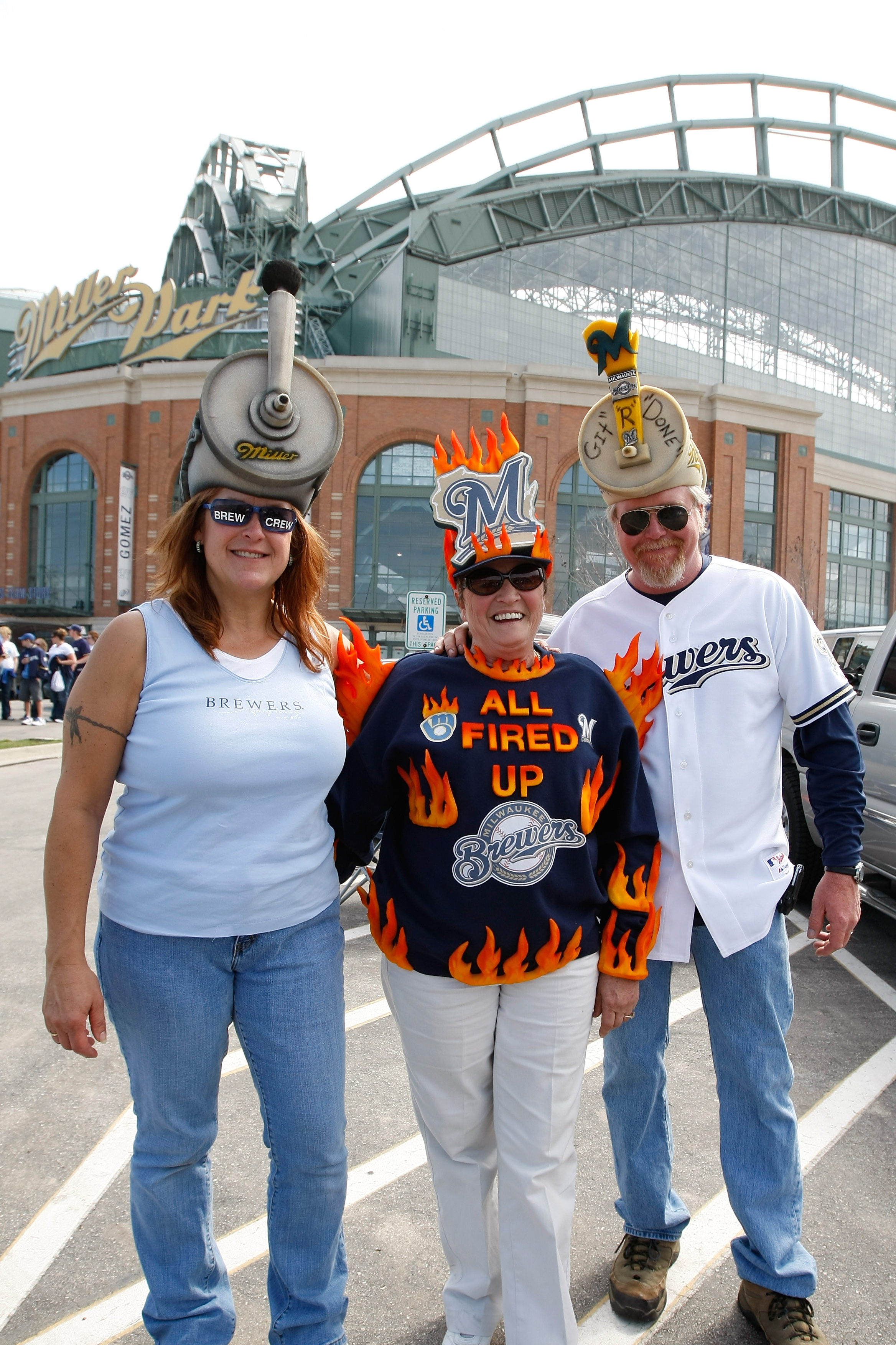 MILWAUKEE, WI - APRIL 05: Brewers fans pose for a picture as they tailgate outside of Miller Park prior to the game between the Colorado Rockies and the Milwaukee Brewers at Miller Park on April 5, 2010 in Milwaukee, Wisconsin. (Photo by Scott Boehm/Getty