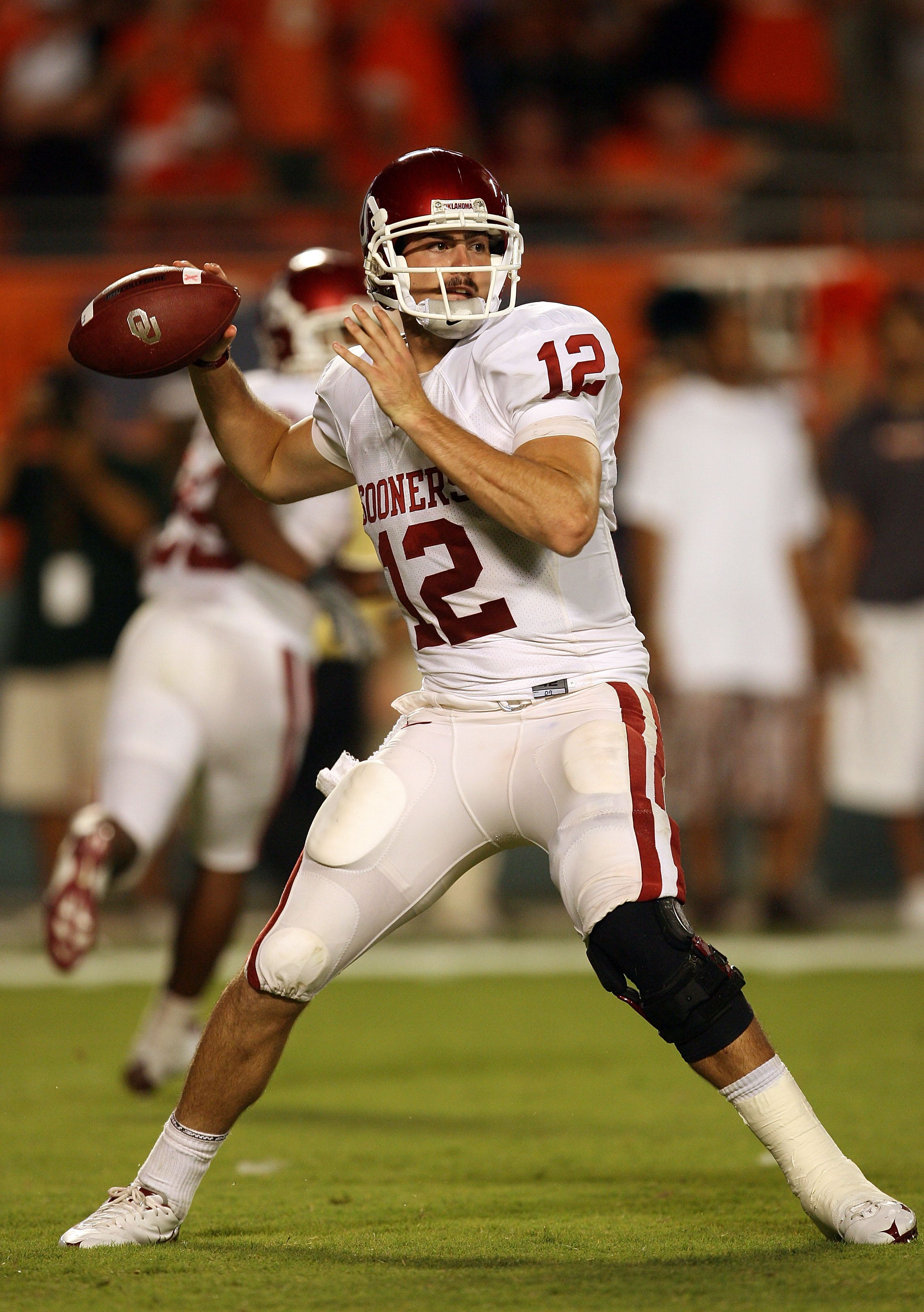 FORT LAUDERDALE, FL - OCTOBER 03: Quarterback Landry Jones #12 of the Oklahoma Sooners throws a pass against the Miami Hurricanes at Land Shark Stadium on October 3, 2009 in Fort Lauderdale, Florida. Miami defeated Oklahoma 21-20. (Photo by Doug Benc/Gett
