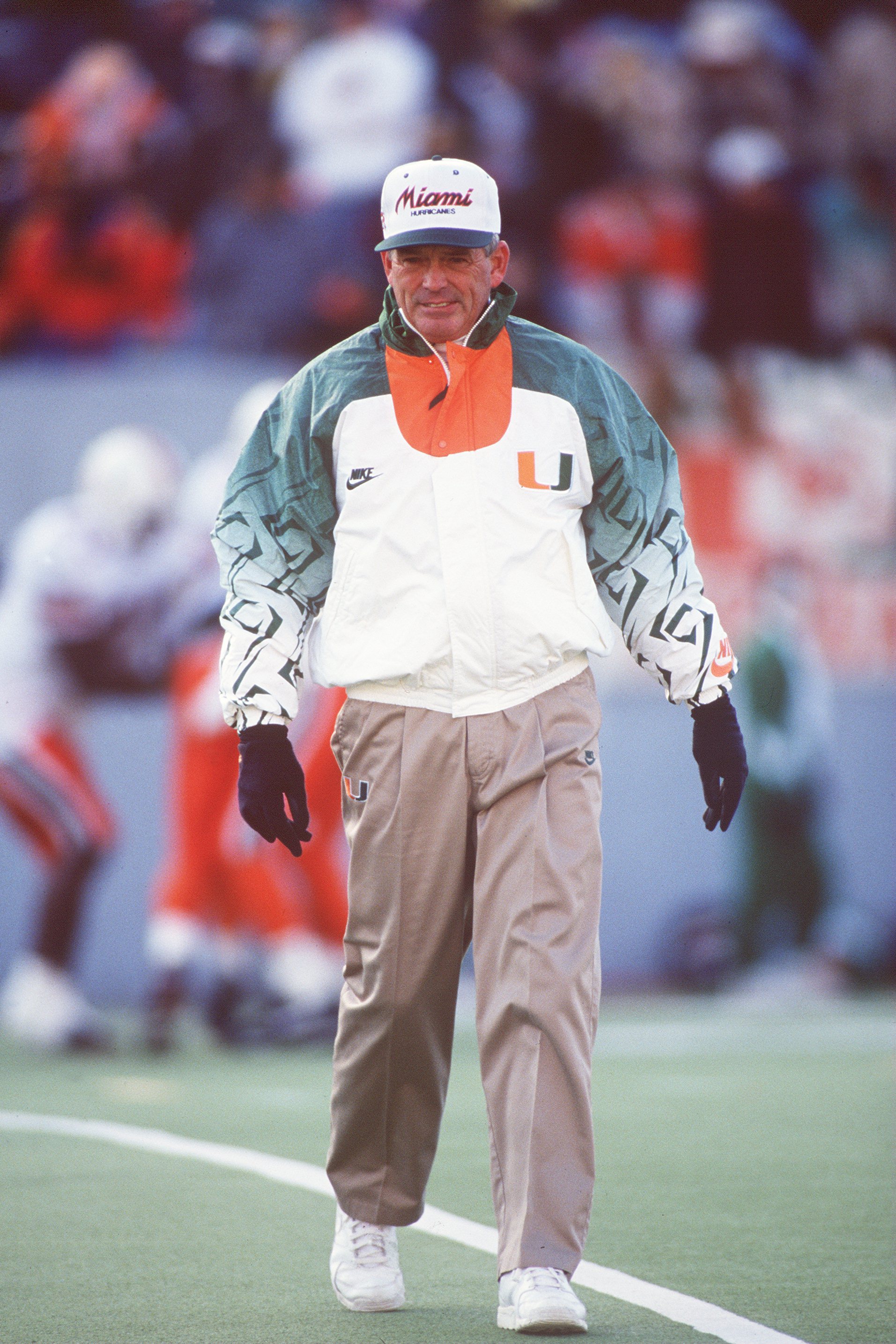 20 NOV 1993: UNIVERSITY OF MIAMI HEAD COACH DENNIS ERICKSON WALKS OFF THE FIELD DURING THE HURRICANES 17-14 LOSS TO THE UNIVERSITY OF WEST VIRGINIA MOUNTAINEERS AT MOUNTAINEER FIELD IN MORGANTOWN, WEST VIRGINIA. Mandatory Credit: Doug Pensinger/ALLSPORT