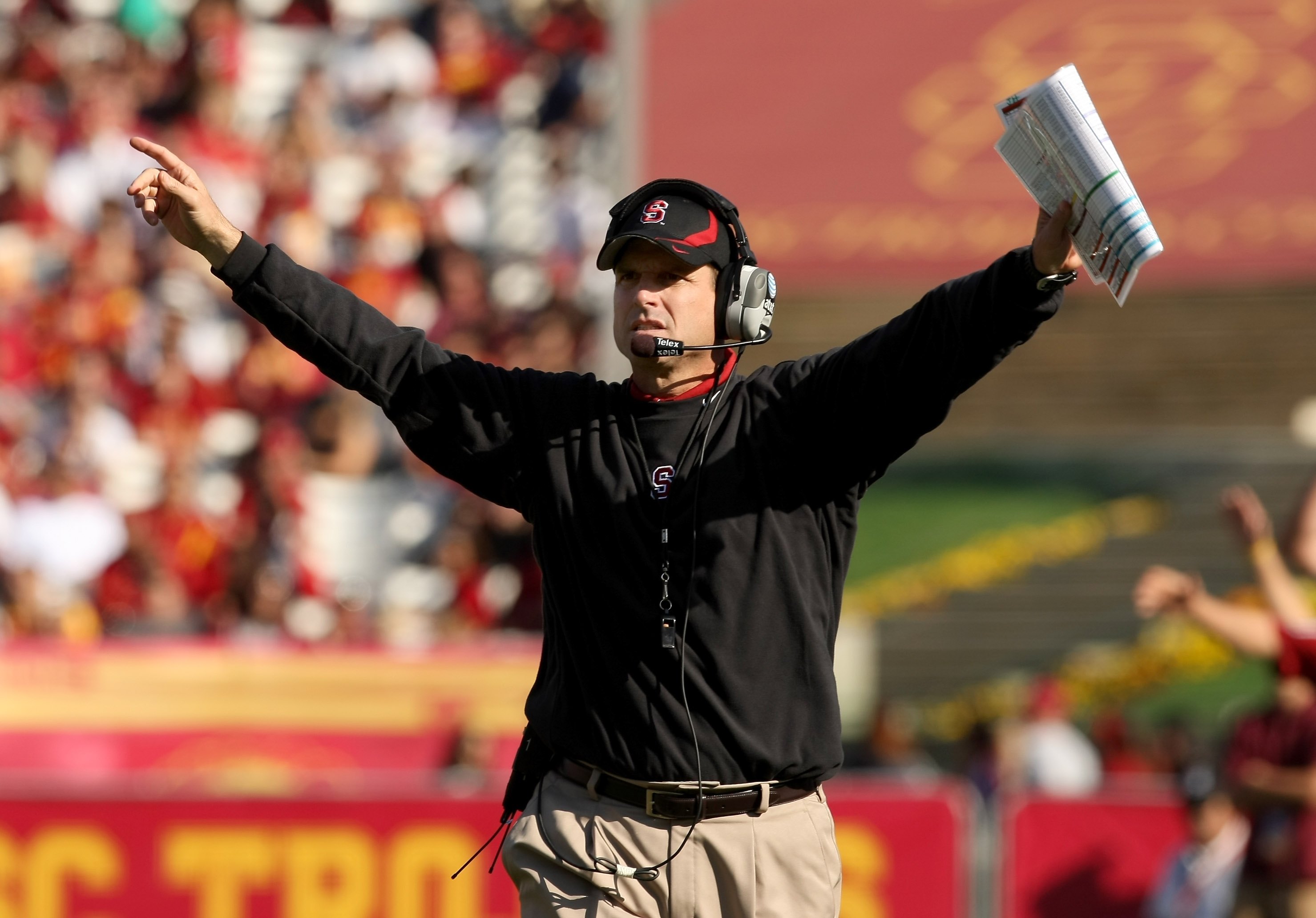 LOS ANGELES, CA - NOVEMBER 14: Head coach Jim Harbaugh of the Stanford Cardinal signals during the game with the USC Trojans on November 14, 2009 at the Los Angeles Coliseum in Los Angeles, California. Stanford won 55-21. (Photo by Stephen Dunn/Getty I