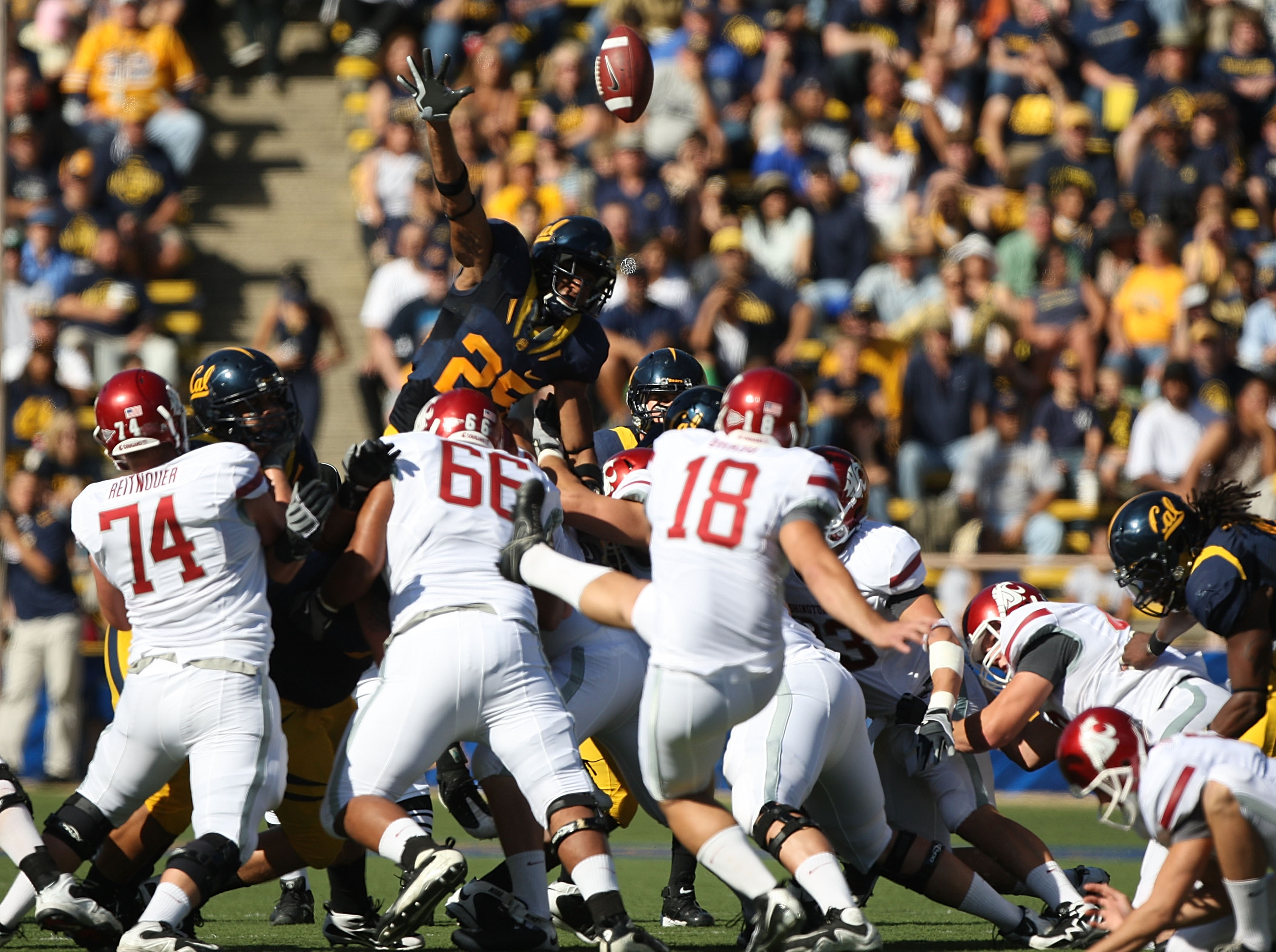 BERKELEY, CA - OCTOBER 24: Bret Johnson #25 of the California Golden Bears attempts to block a field goal by Nico Grasu #18 of the Washington State Cougars at California Memorial Stadium on October 24, 2009 in Berkeley, California.