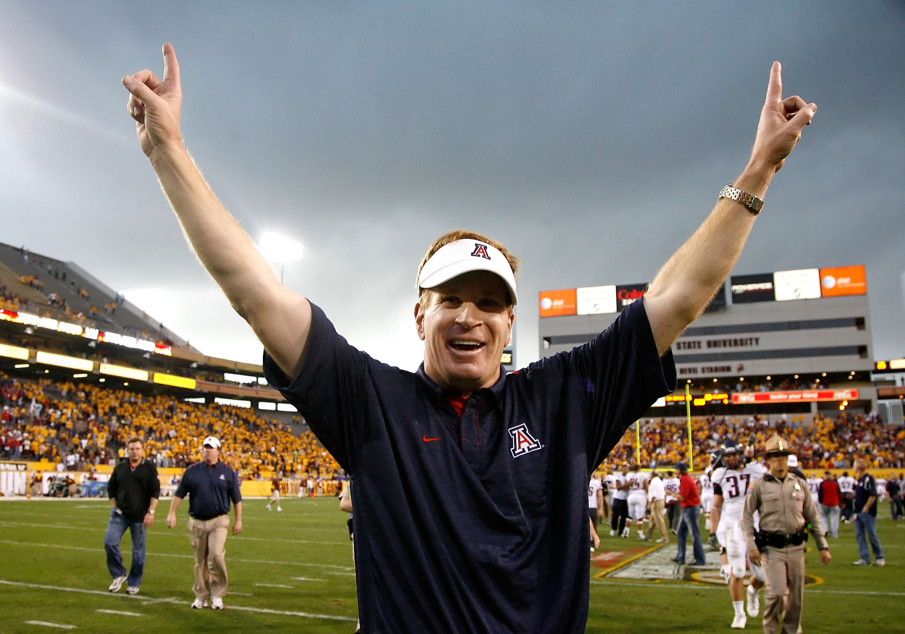 TEMPE, AZ - NOVEMBER 28: Head coach Mike Stoops of the Arizona Wildcats celebrates after defeating the Arizona State Sun Devils in the college football game at Sun Devil Stadium on November 28, 2009 in Tempe, Arizona. The Wildcats defeated the Sun Devil