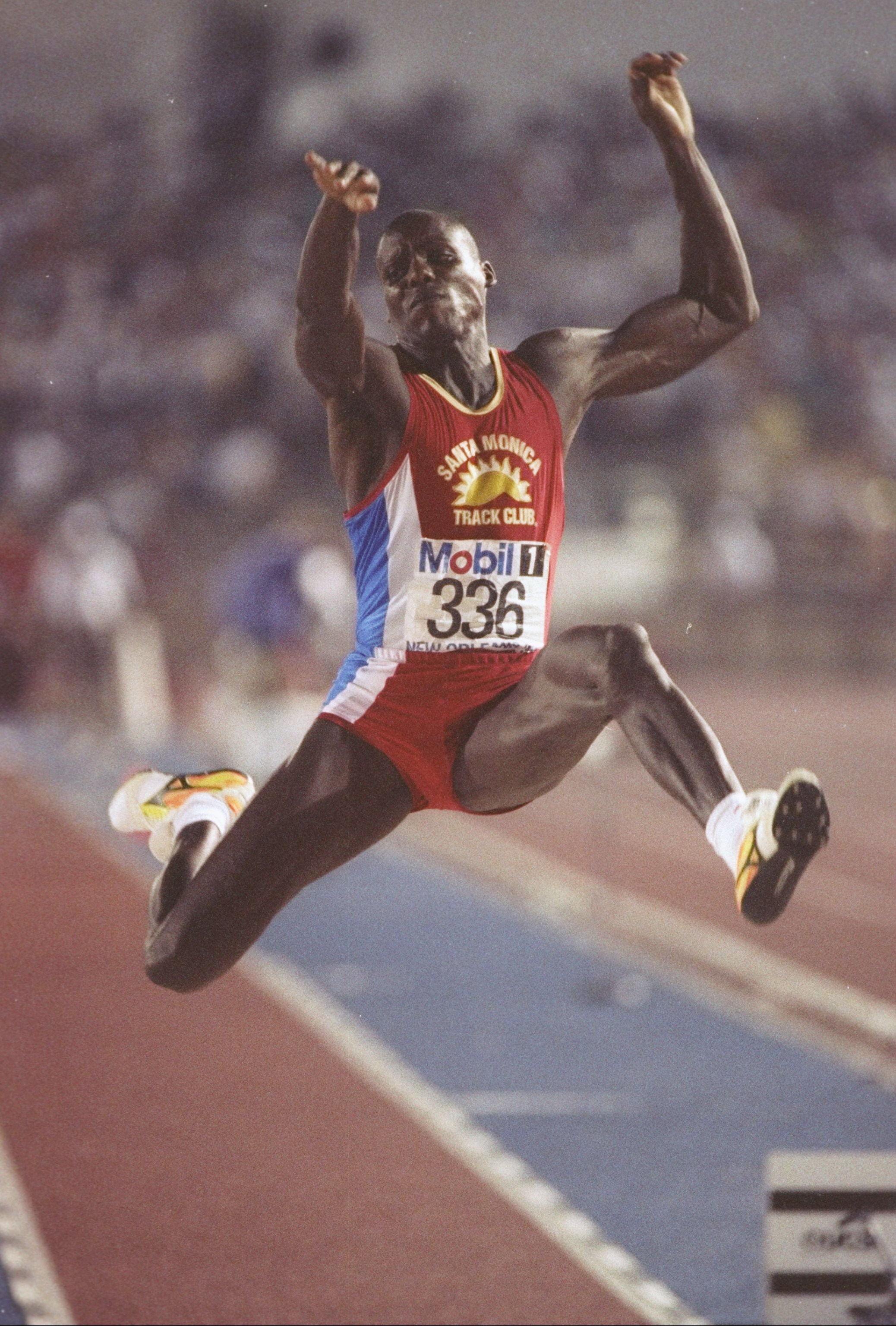 1992:  Carl Lewis is stretching his long jump at the U.S. Track and Field Trials in New Orleans, Louisiana. Mandatory Credit: Tony Duffy  /Allsport