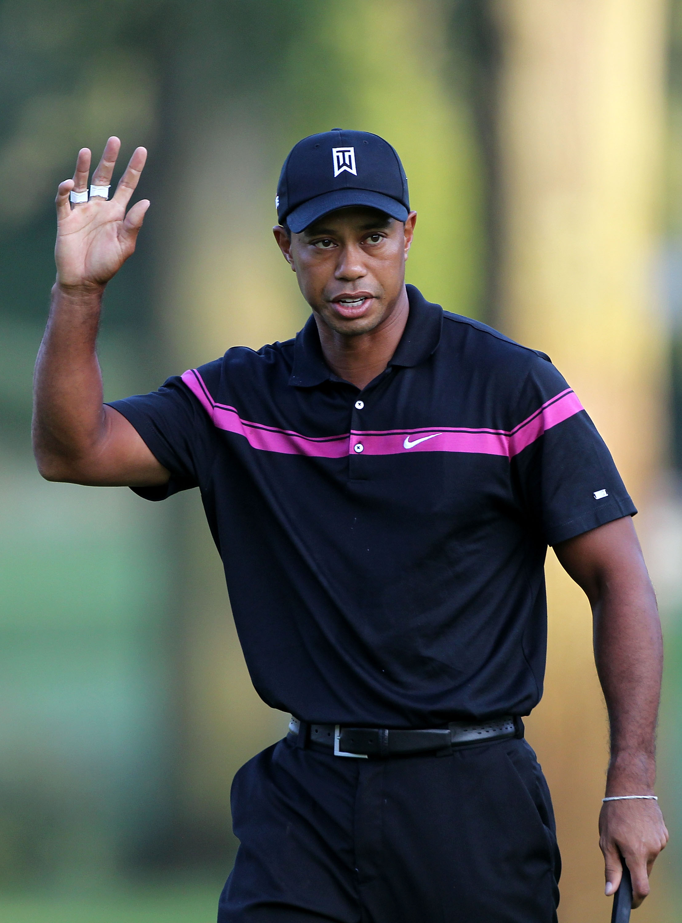 PARAMUS, NJ - AUGUST 26:  Tiger Woods reacts after he made a birdie putt on the first hole during the first round of The Barclays at the Ridgewood Country Club on August 26, 2010 in Paramus, New Jersey.  (Photo by Hunter Martin/Getty Images)