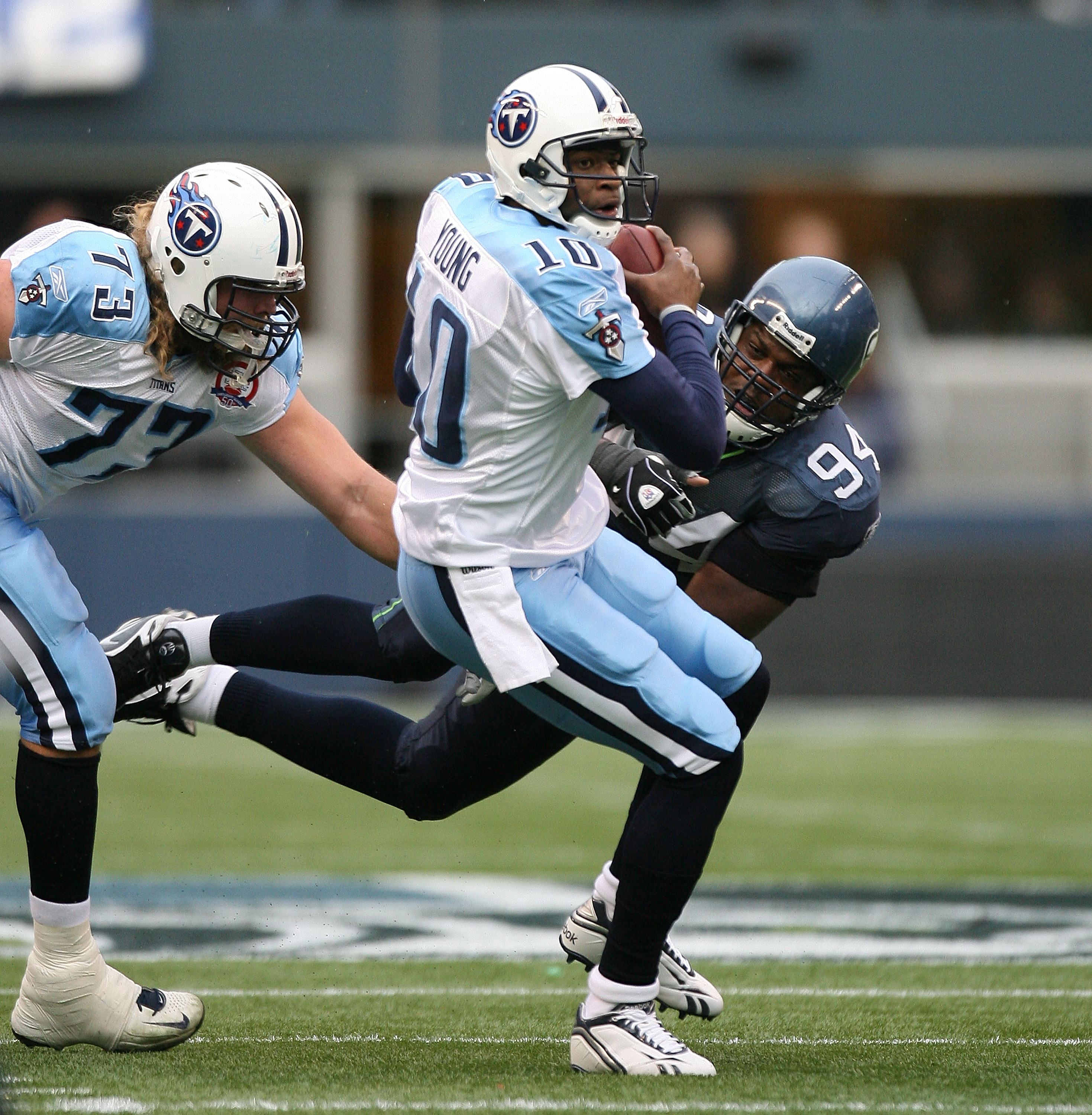 Tennessee Titans quarterback Vince Young (10) is tackled by