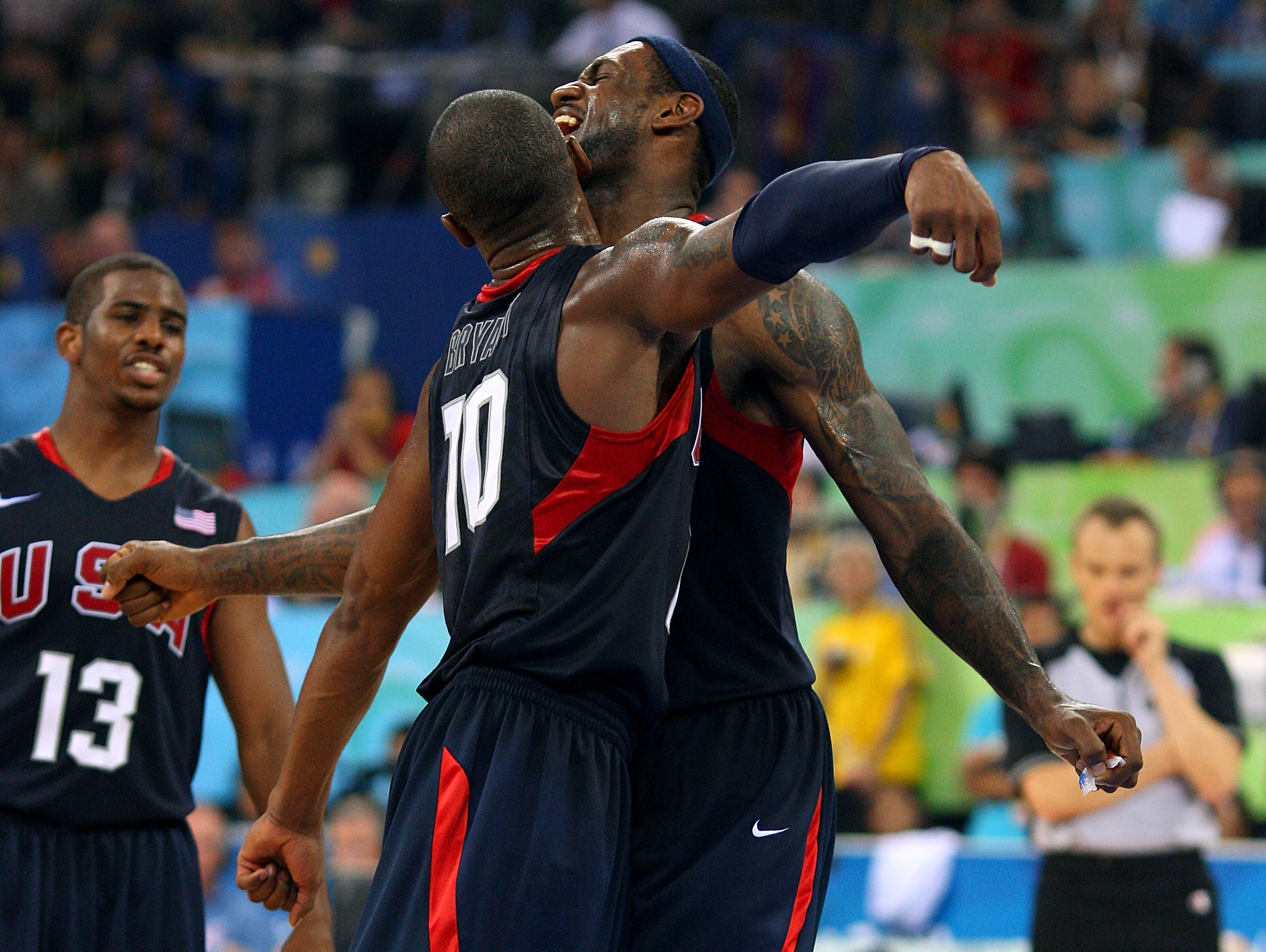 BEIJING - AUGUST 24:  LeBron James #6 Kobe Bryant #10 and Chris Paul #13 of the United States celebrate after defeating Spain 118-107 in the gold medal game during Day 16 of the Beijing 2008 Olympic Games at the Beijing Olympic Basketball Gymnasium on Aug