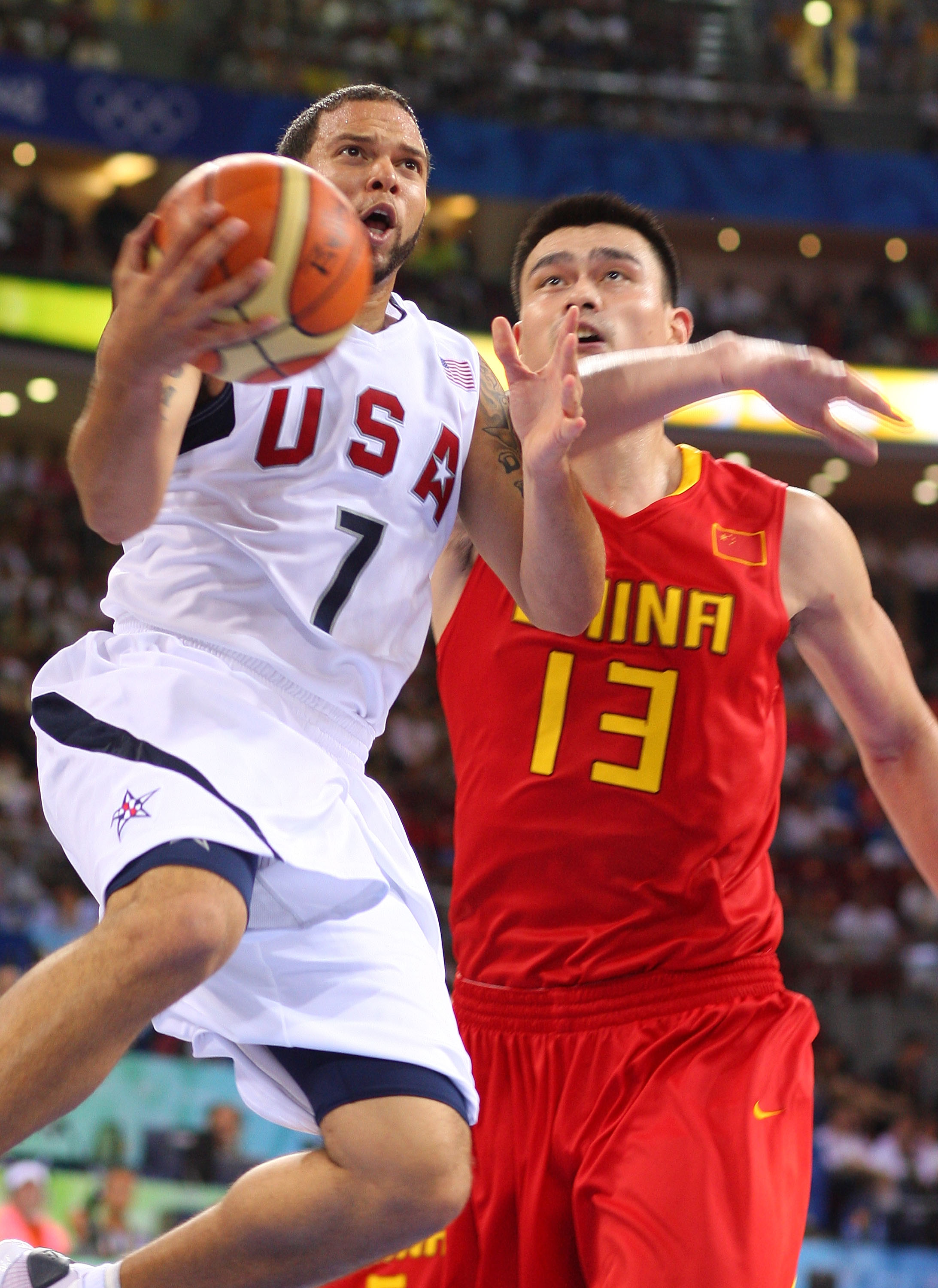 BEIJING - AUGUST 10:  Deron Williams #7 of the United States drives past Yao Ming #13 of China during the day 2 preliminary game at the Beijing 2008 Olympic Games in the Beijing Olympic Basketball Gymnasium on August 10, 2008 in Beijing, China.  (Photo by