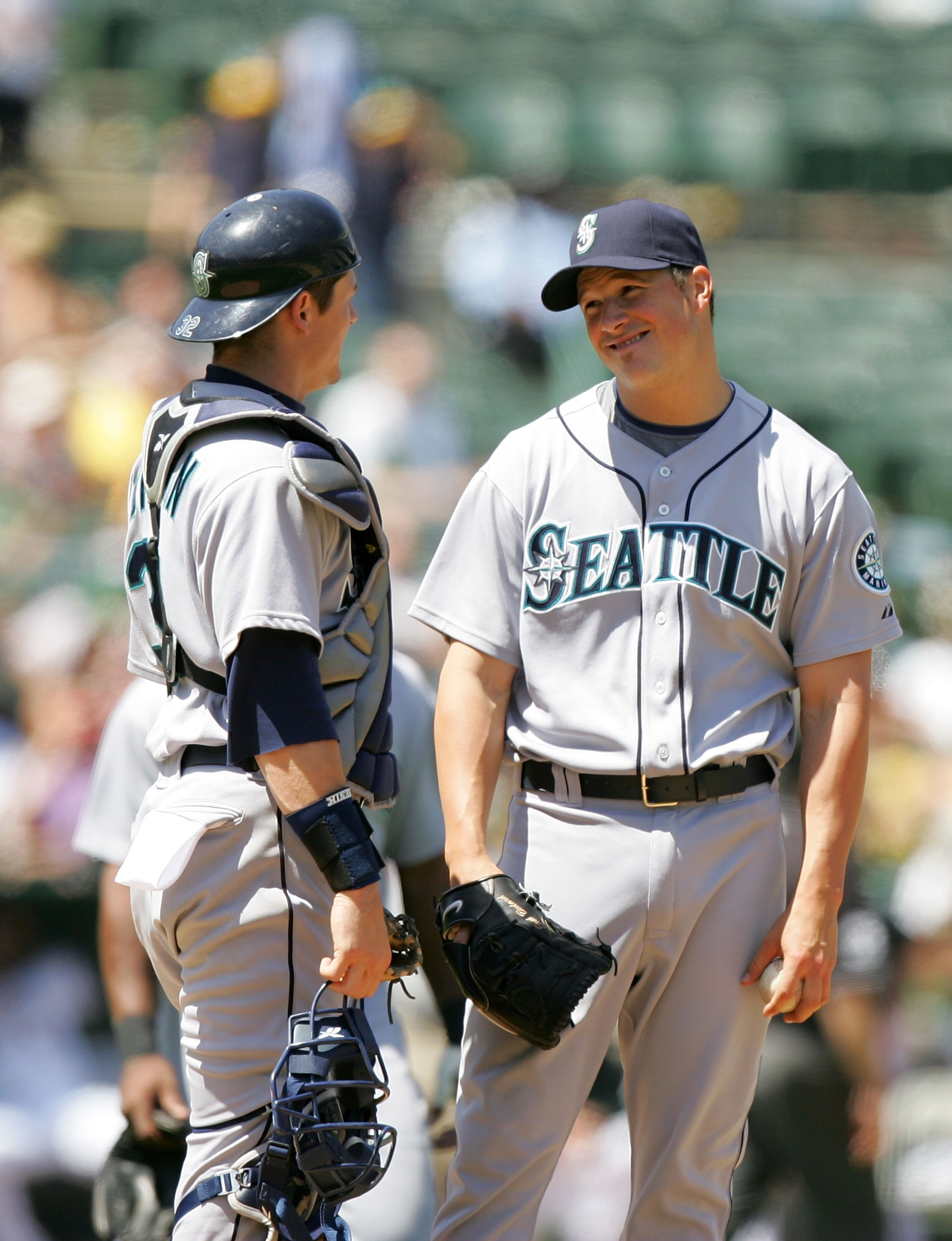 OAKLAND, CA - MAY 27:  Erik Bedard #45 of the Seattle Mariners talks to catcher Rob Johnson #32 before he is taken out of their game against the Oakland Athletics at the Oakland Coliseum on May 27, 2009 in Oakland, California.  (Photo by Ezra Shaw/Getty I