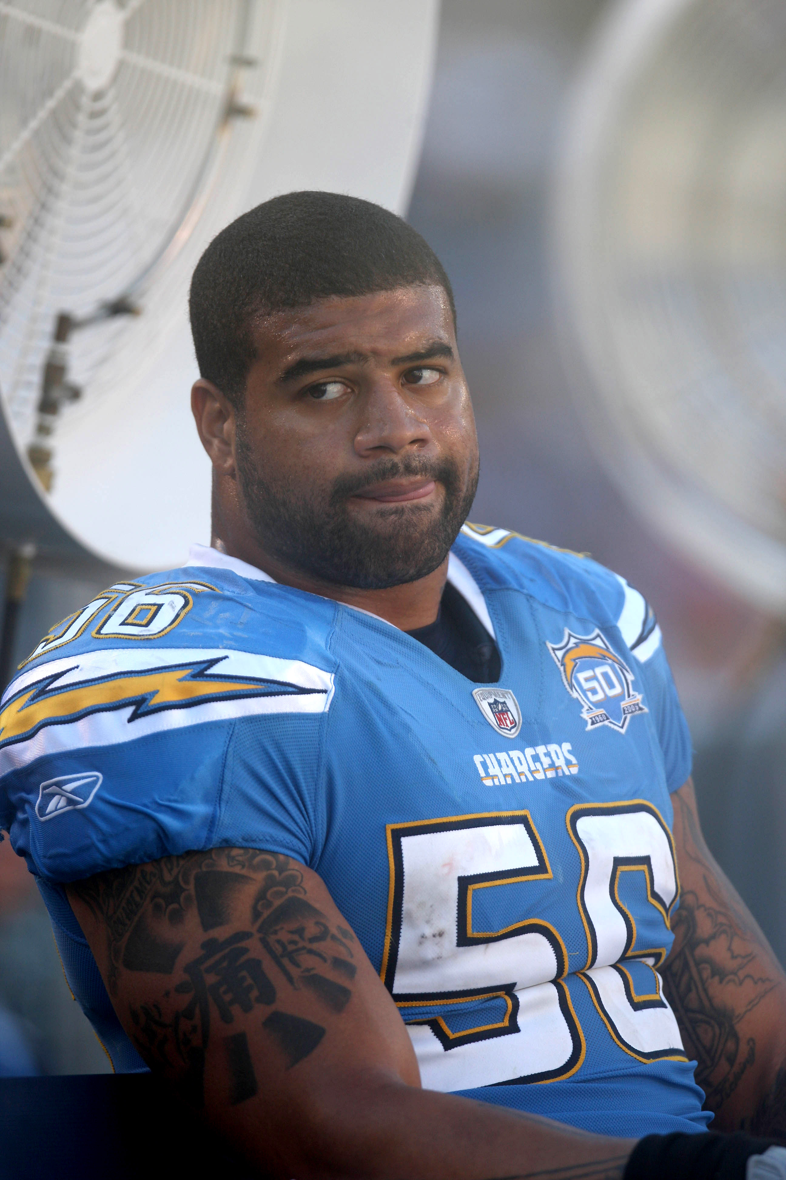 Oct 15, 2006; San Francisco, CA, USA; San Diego Chargers SHAWNE MERRIMAN  looses his helmet as he celebrates a tackle for a loss on San Francisco  Forty Niner Frank Gore in the