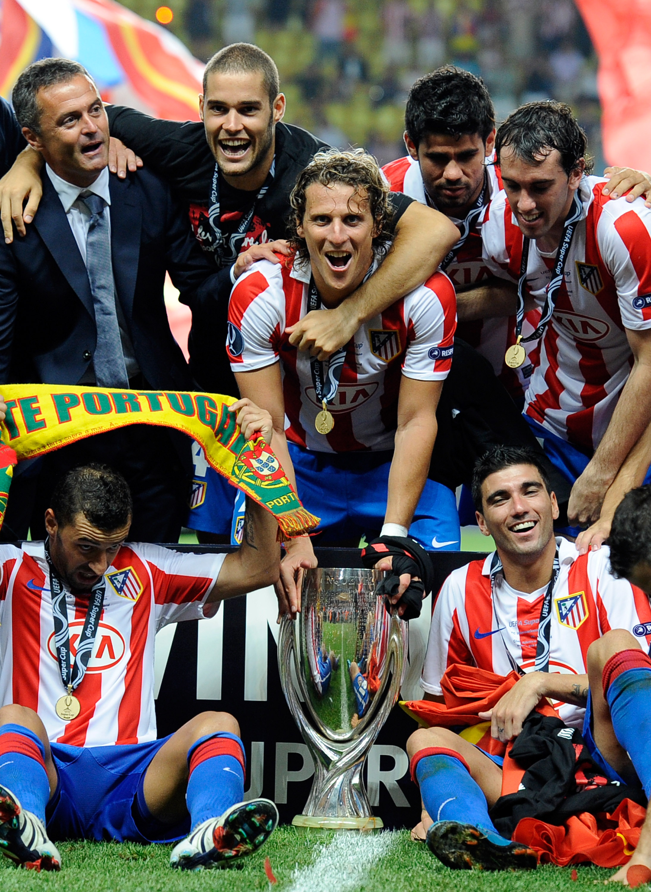 MONACO - AUGUST 27:  Diego Forlan of Atletico Madrid celebrates with team mates after winning the UEFA Super Cup between Inter and Atletico Madrid at Louis II Stadium on August 27, 2010 in Monaco, Monaco.  (Photo by Claudio Villa/Getty Images)