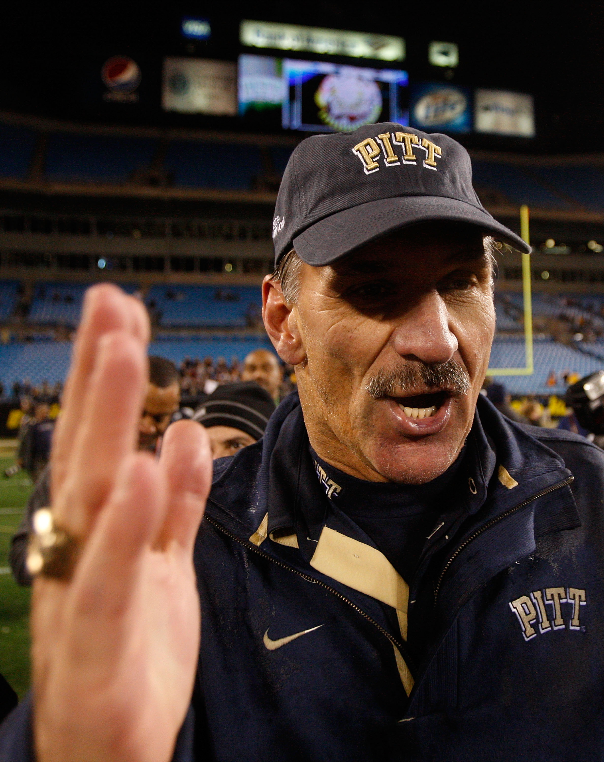 CHARLOTTE, NC - DECEMBER 26:  Head coach Dave Wannstedt of the Pittsburgh Panthers celebrates with players after a 19-17 victory over the North Carolina Tar Heels on December 26, 2009 in Charlotte, North Carolina.  (Photo by Streeter Lecka/Getty Images)