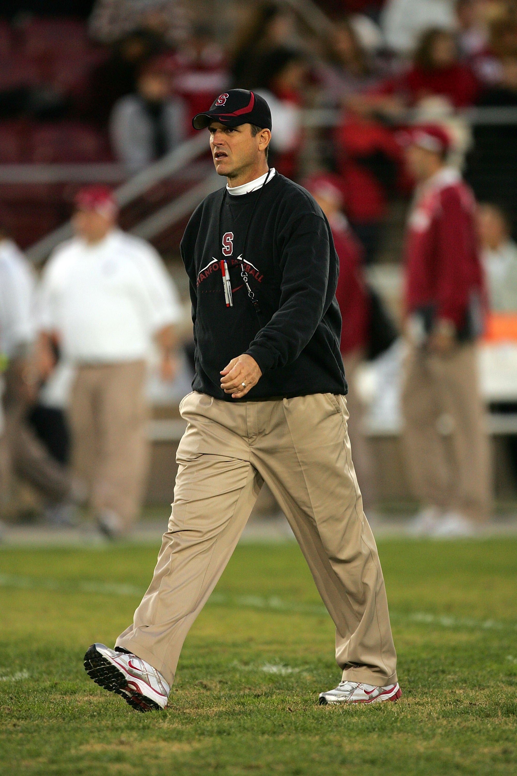 PALO ALTO, CA - NOVEMBER 28:  Stanford Cardinal head coach Jim Harbaugh walks off the field after warm ups before their game against the Notre Dame Fighting Irish at Stanford Stadium on November 28, 2009 in Palo Alto, California.  (Photo by Ezra Shaw/Gett
