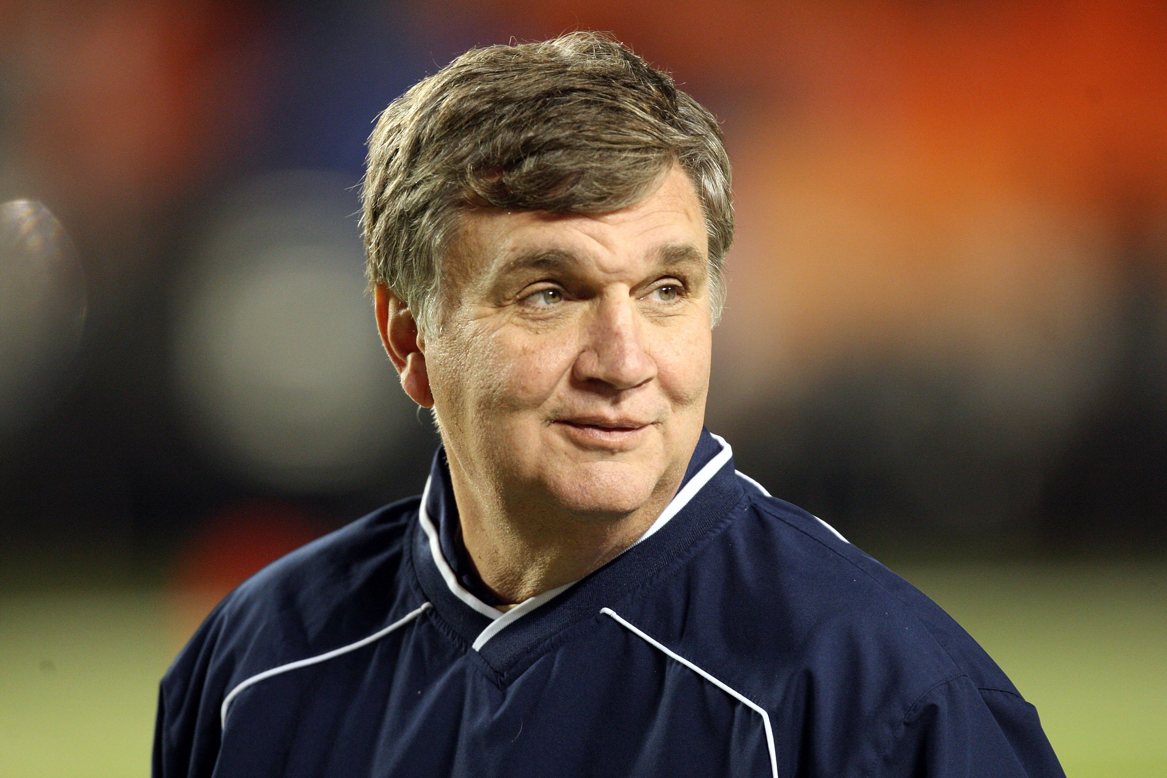 MIAMI GARDENS, FL - JANUARY 05:  Head coach Paul Johnson of the Georgia Tech Yellow Jackets smiles on the field during warm ups against the Iowa Hawkeyes during the FedEx Orange Bowl at Land Shark Stadium on January 5, 2010 in Miami Gardens, Florida. Iowa