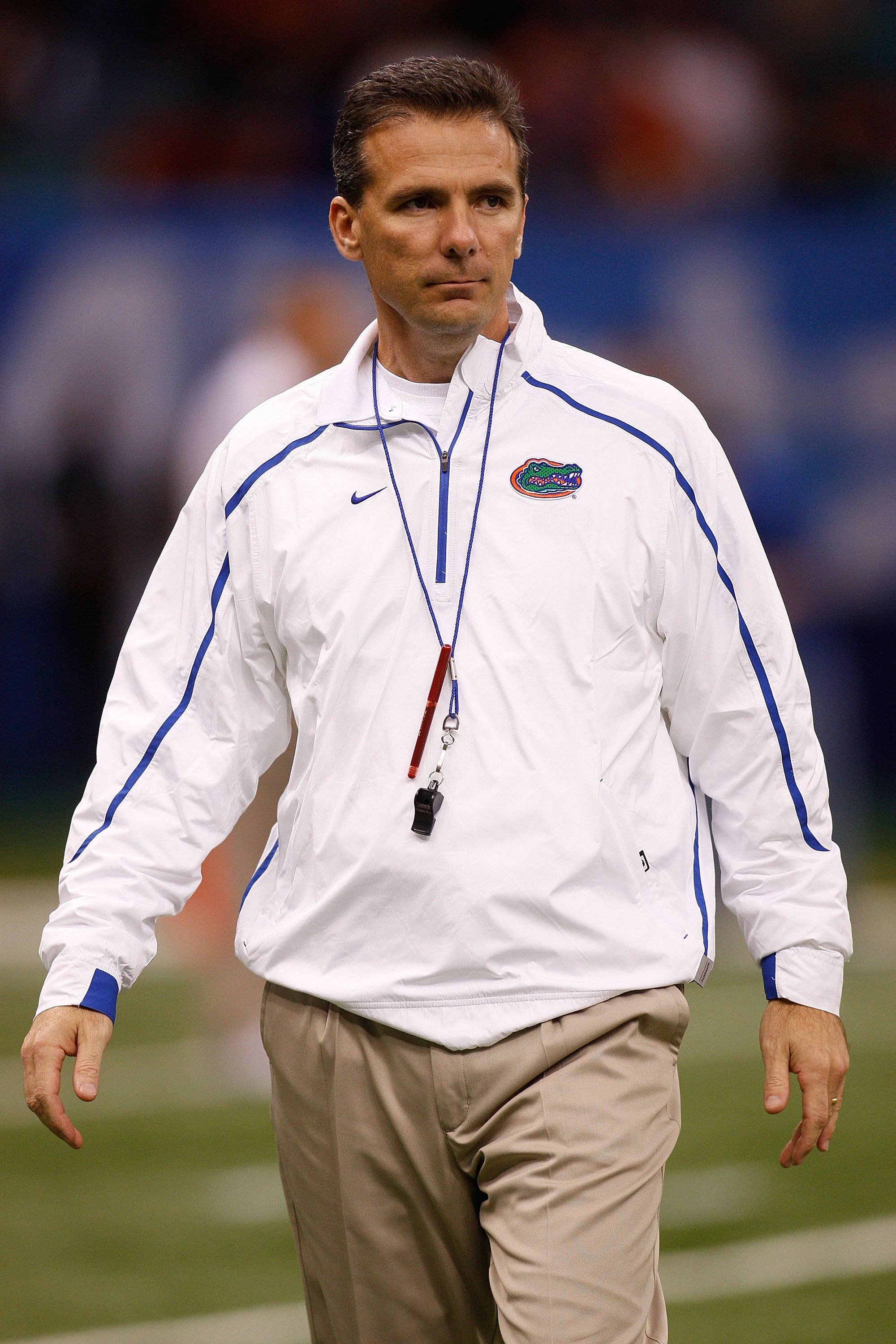 NEW ORLEANS - JANUARY 01:  Head coach Urban Meyer of the Florida Gators watches his team warm up before playing the Cincinnati Bearcats during the Allstate Sugar Bowl at the Louisana Superdome on January 1, 2010 in New Orleans, Louisiana.  (Photo by Chris