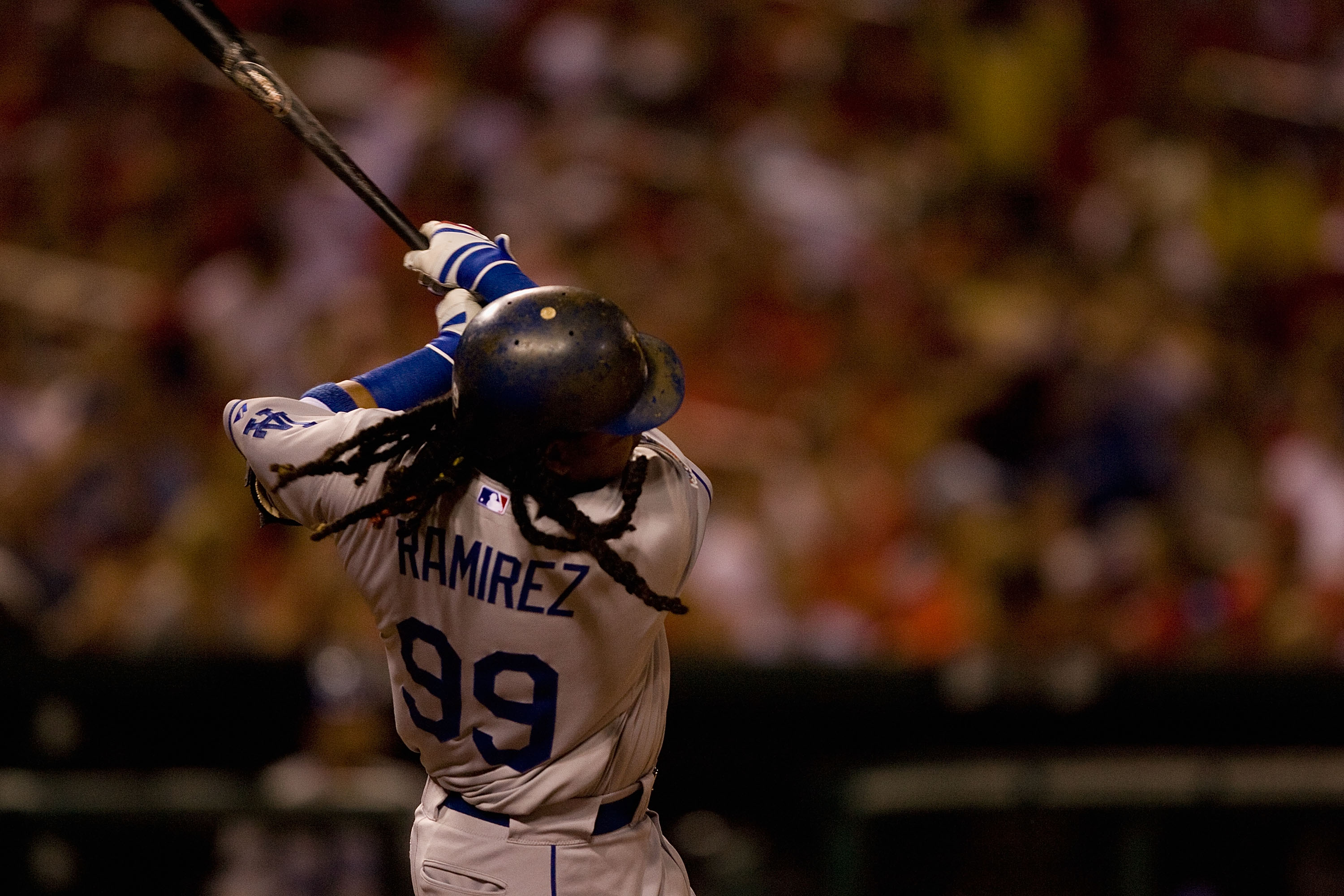 Boston Red Sox' Manny Ramirez swings for a grand slam during the