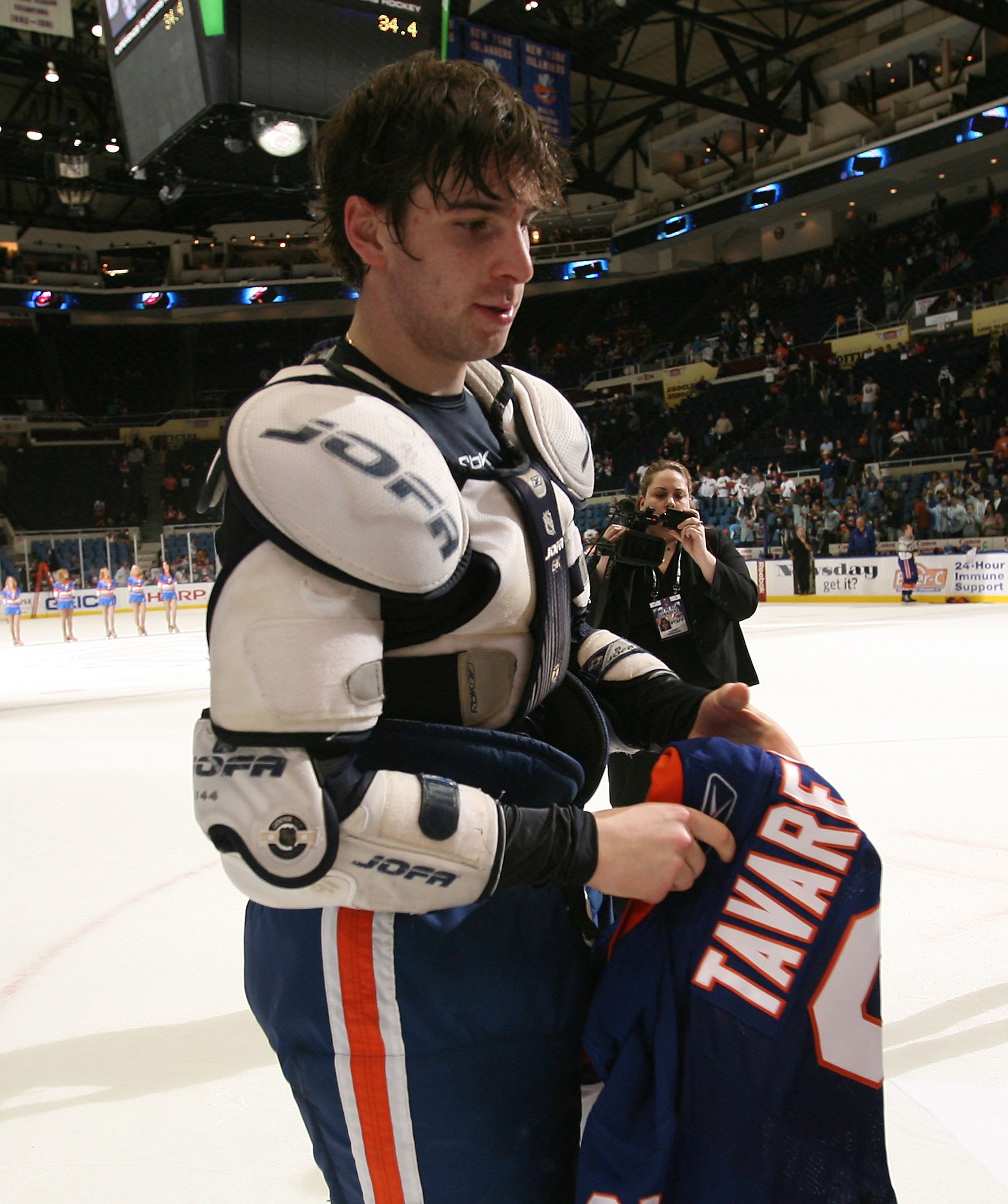 UNIONDALE, NY - APRIL 11: John Tavares #91 of the New York Islanders signs autographs for fans following his game against the Pittsburgh Penguins at the Nassau Coliseum on April 11, 2010 in Uniondale, New York. (Photo by Bruce Bennett/Getty Images)