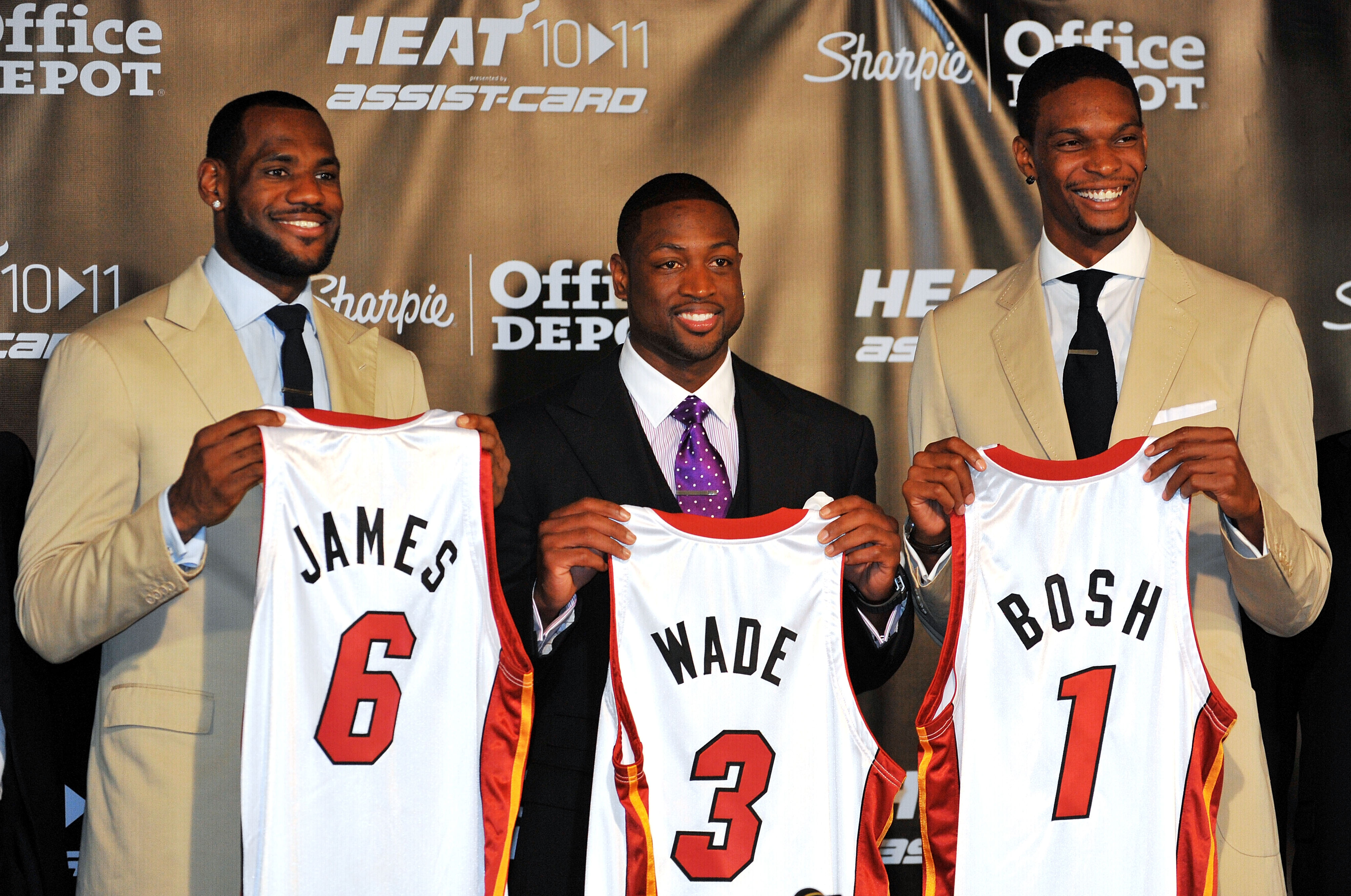 MIAMI - JULY 09:  LeBron James #6, Dwyane Wade #3 and Chris Bosh #1 of the Miami Heat show off their new game jerseys before a press conference after a welcome party at American Airlines Arena on July 9, 2010 in Miami, Florida.  (Photo by Doug Benc/Getty