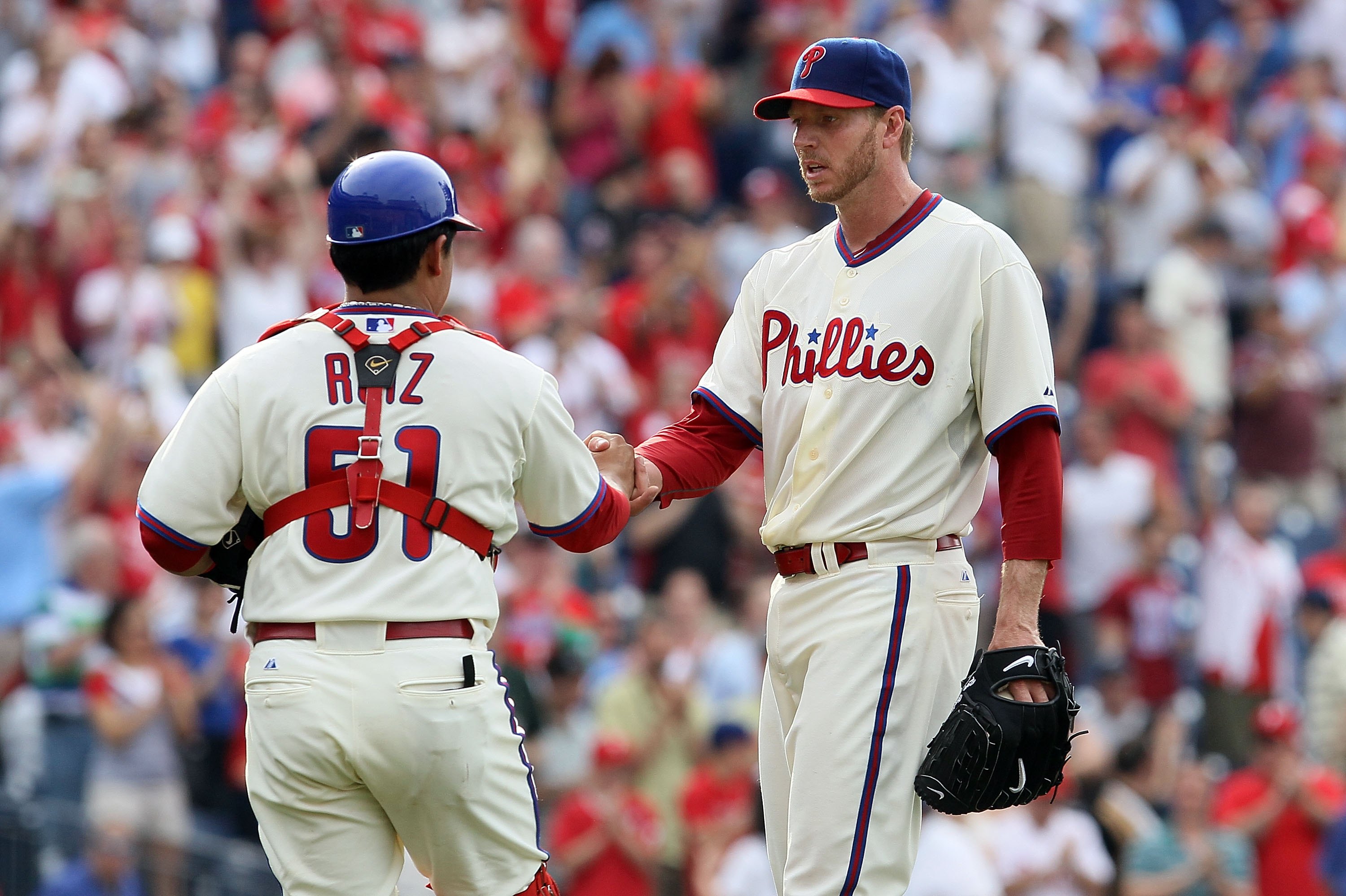 PHILADELPHIA - MAY 01:  Roy Halladay #34 and Carlos Ruiz #51 of the Philadelphia Phillies celebrate after defeating the New York Mets at Citizens Bank Park on May 1, 2010 in Philadelphia, Pennsylvania.  (Photo by Jim McIsaac/Getty Images)