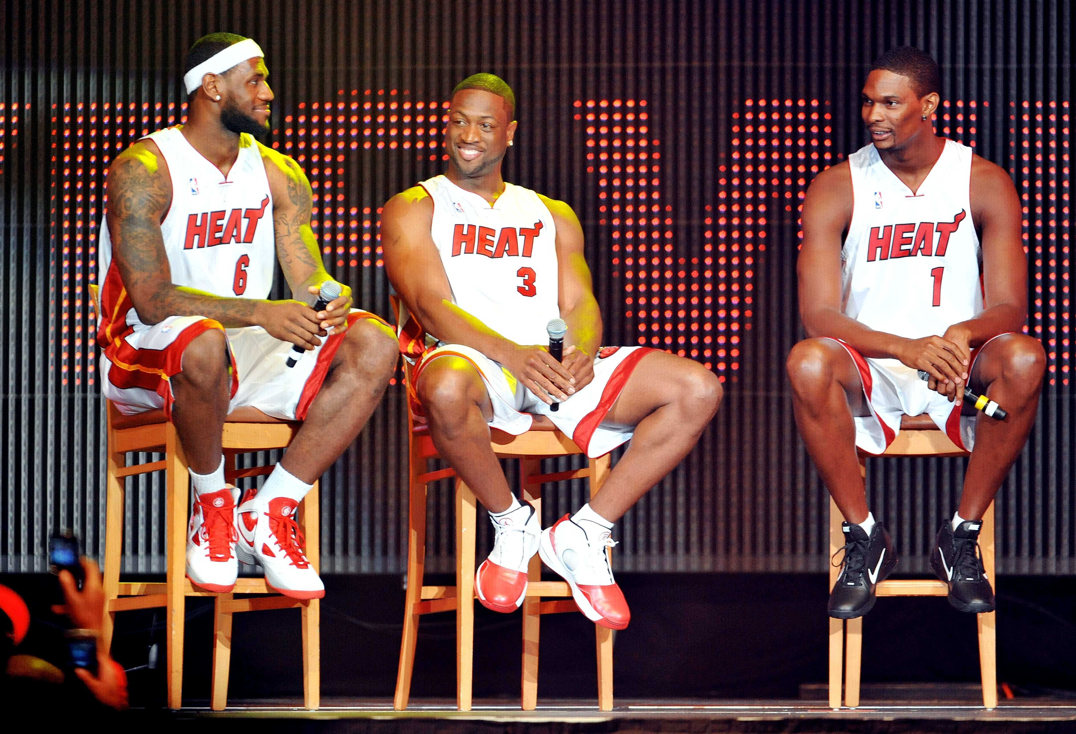 MIAMI - JULY 09:   LeBron James #6, Dwyane Wade #3 and Chris Bosh #1 of the Miami Heat speak after being introduced to fans during a welcome party at American Airlines Arena on July 9, 2010 in Miami, Florida.  (Photo by Doug Benc/Getty Images)
