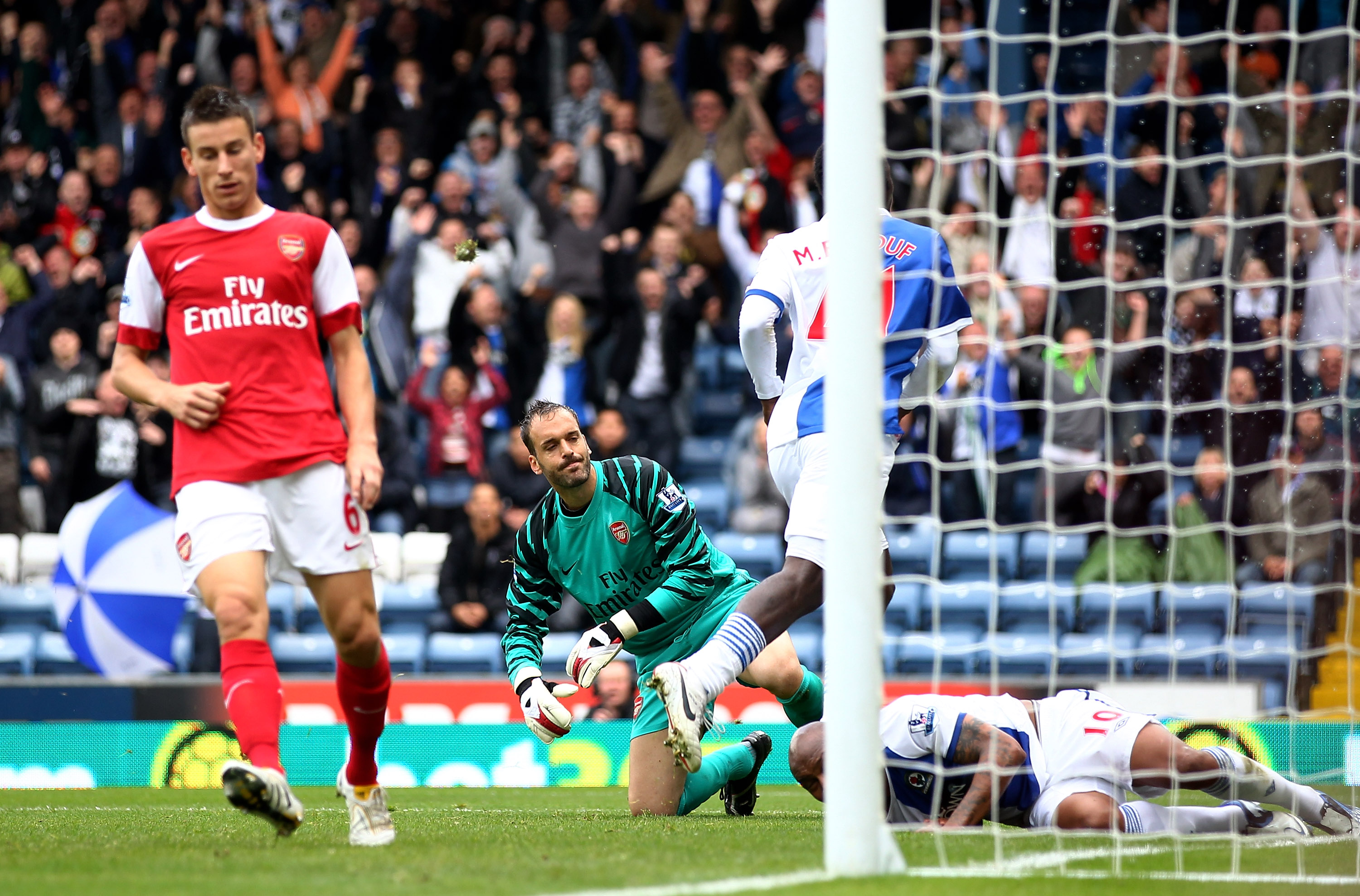 BLACKBURN, ENGLAND - AUGUST 28:  Manuel Almunia of Arsenal reacts as Mame Biram Diouf of Blackburn Rovers celebrates scoring his team's first goal during the Barclays Premier League match between Blackburn Rovers and Arsenal at Ewood Park on August 28, 20