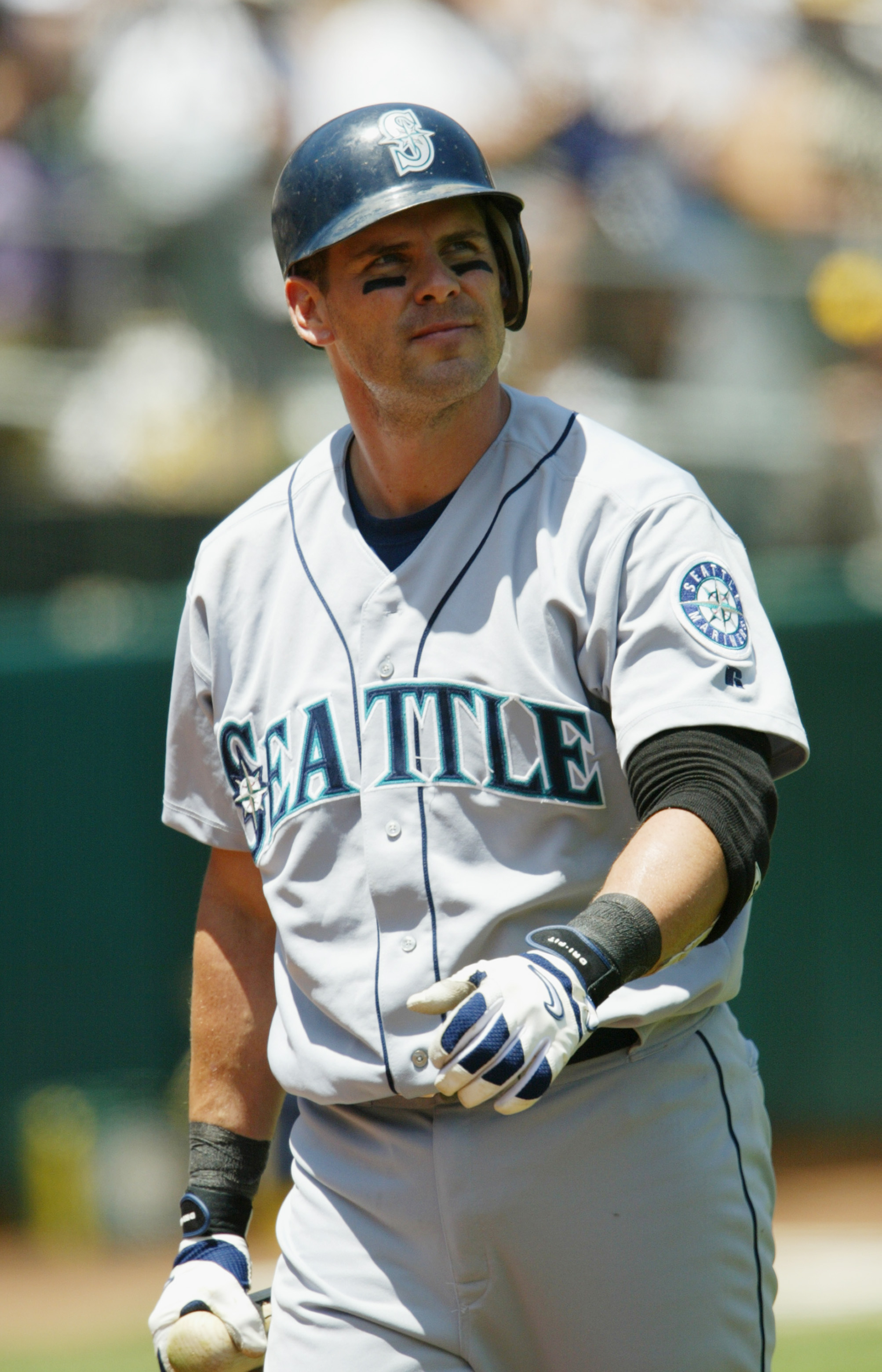 OAKLAND, CA - JULY 3:  Third baseman Jeff Cirillo #7 of the Seattle Mariners walks to the dugout after his at bat during the American League game against the Oakland Athletics on July 3, 2003 at the Network Associates Coliseum in Oakland, California. The