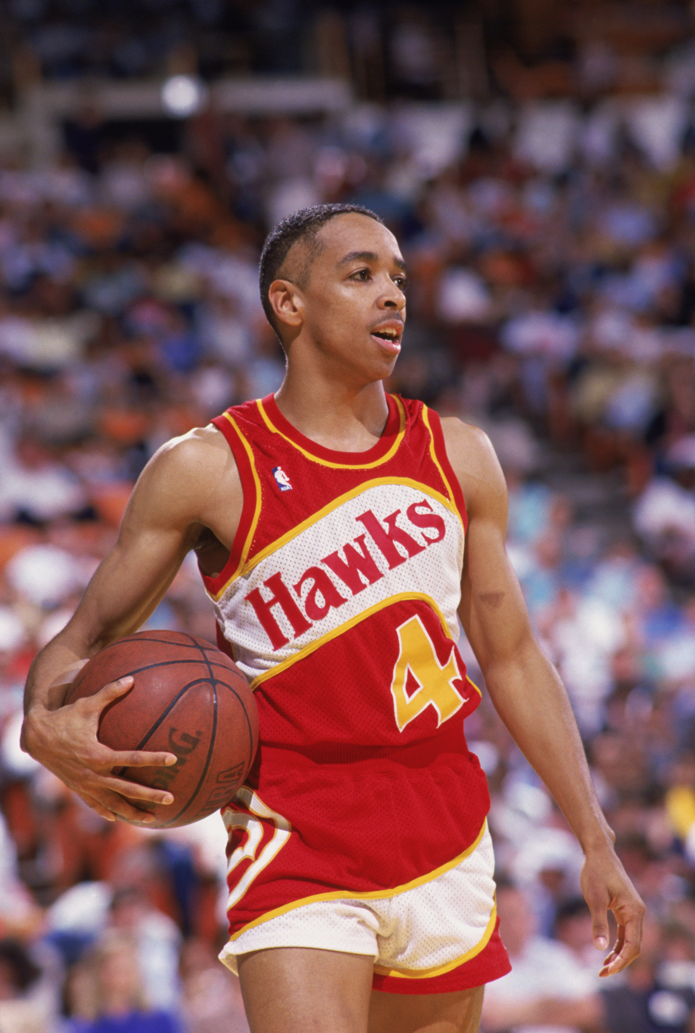 INGLEWOOD, CA - 1988:  Spud Webb #4 of the Atlanta Hawks holds the ball during a NBA game against the Los Angeles Lakers at the Great Western Forum in Inglewood, California in 1988.  (Photo by Mike Powell/Getty Images)