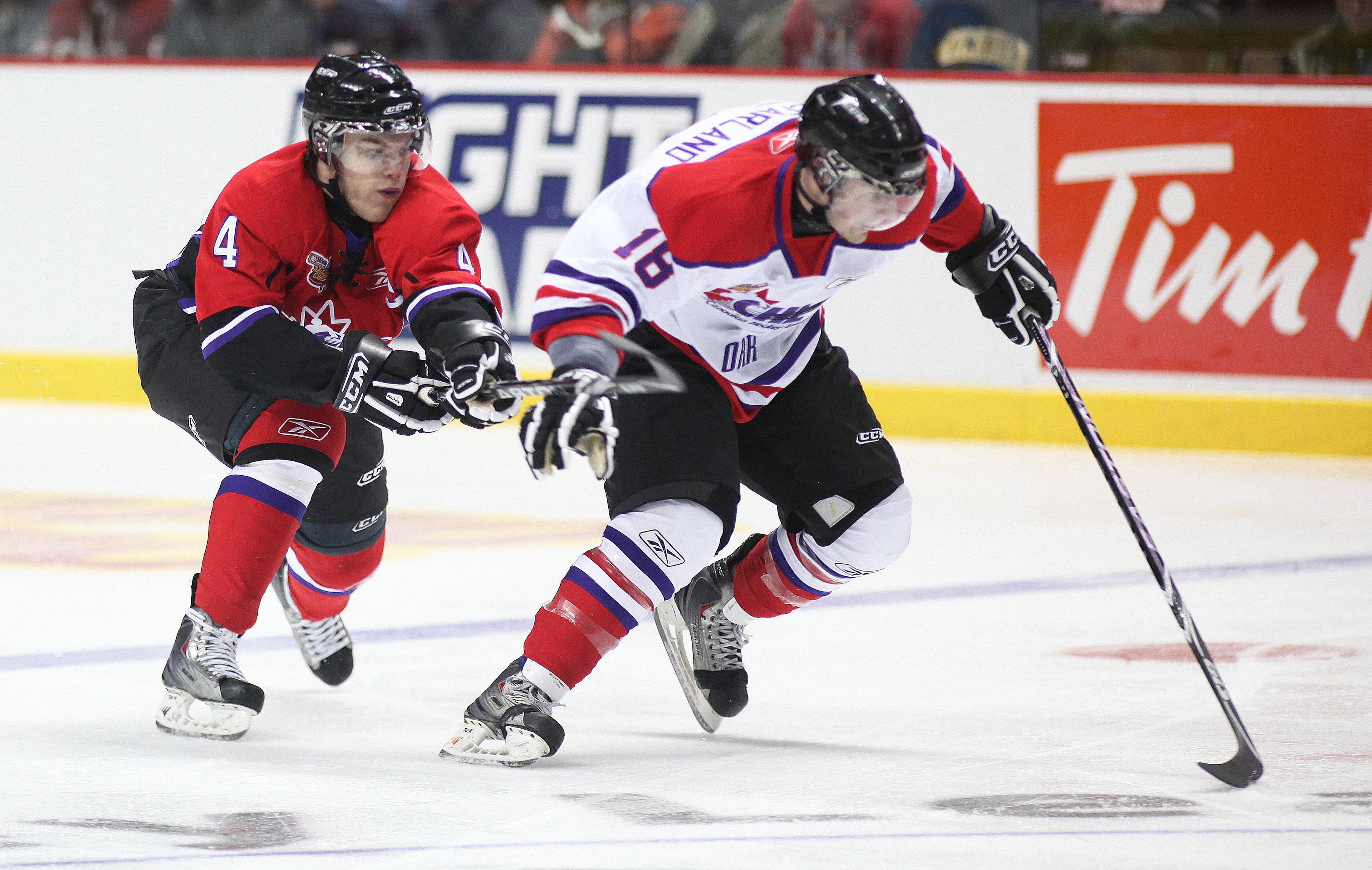 WINDSOR, ON - JANUARY 20: Taylor Hall #4 of Team Cherry tries to stick check John McFarland #18 of Team Orr during the Home Hardware CHL/NHL Top Prospects game on January 20, 2010 at the WFCU Centre in Windsor, Ontario. Team Cherry defeated Team Orr 4-2.