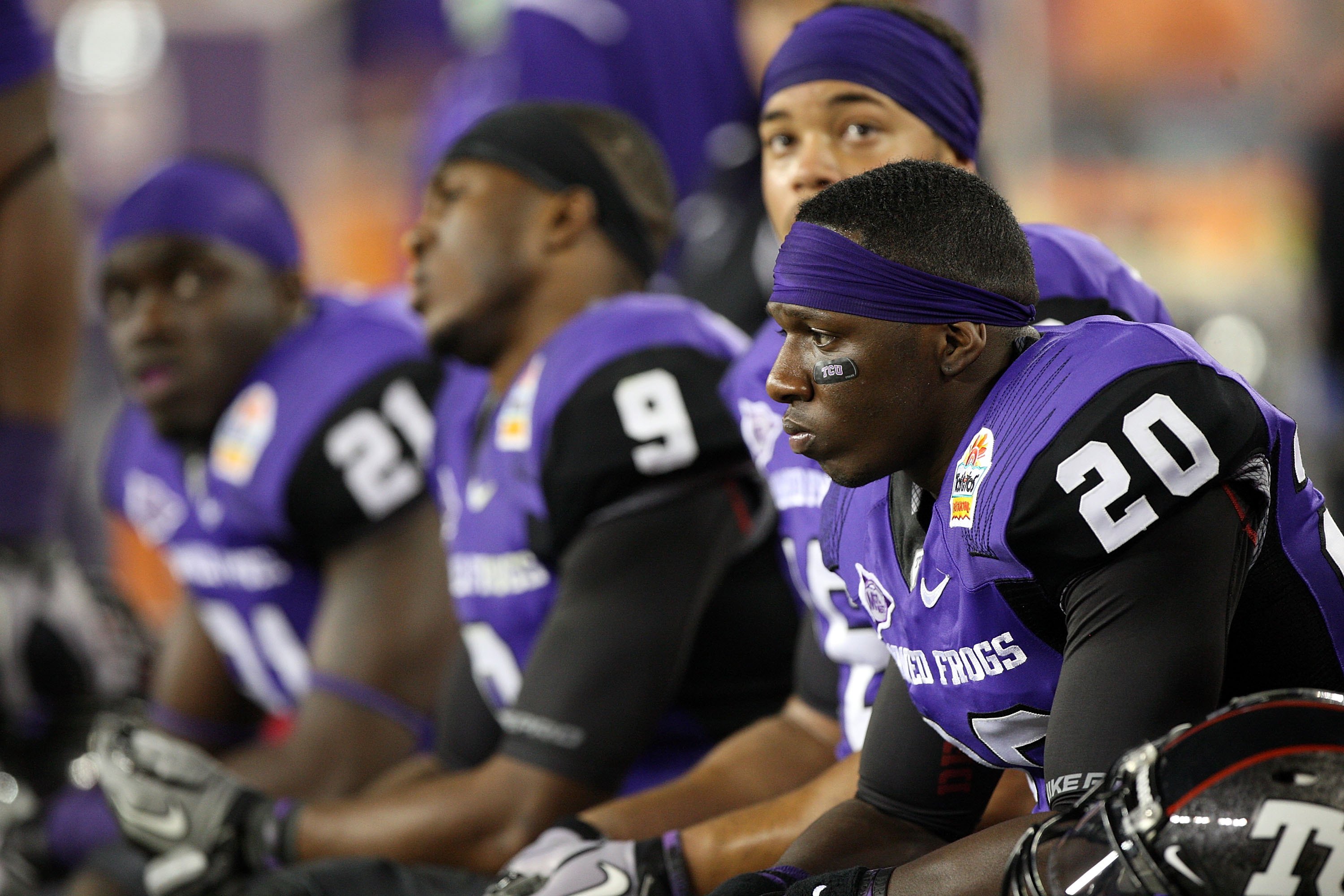 GLENDALE, AZ - JANUARY 04: Nick Sanders #20 of the TCU Horned Frogs sits on the bench with his teammates against the Boise State Broncos during the Tostitos Fiesta Bowl at the Universtity of Phoenix Stadium on January 4, 2010 in Glendale, Arizona. (Phot