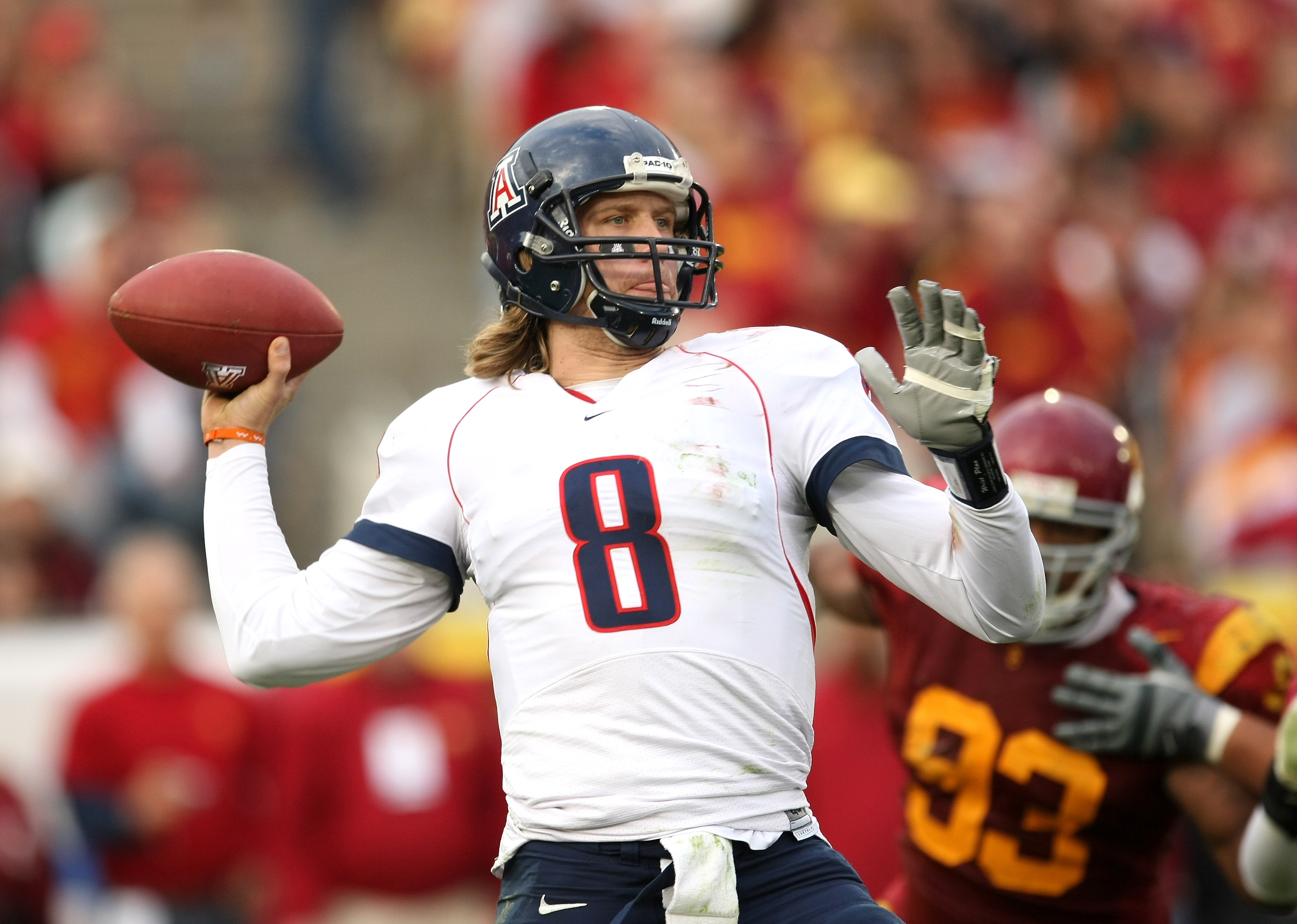 LOS ANGELES - DECEMBER 5: Quarterback Nick Foles #8 of the Arizona Wildcats throws a pass against the USC Trojans on December 5, 2009 at the Los Angeles Coliseum in Los Angeles, California. Arizona won 21-17. (Photo by Stephen Dunn/Getty Images)